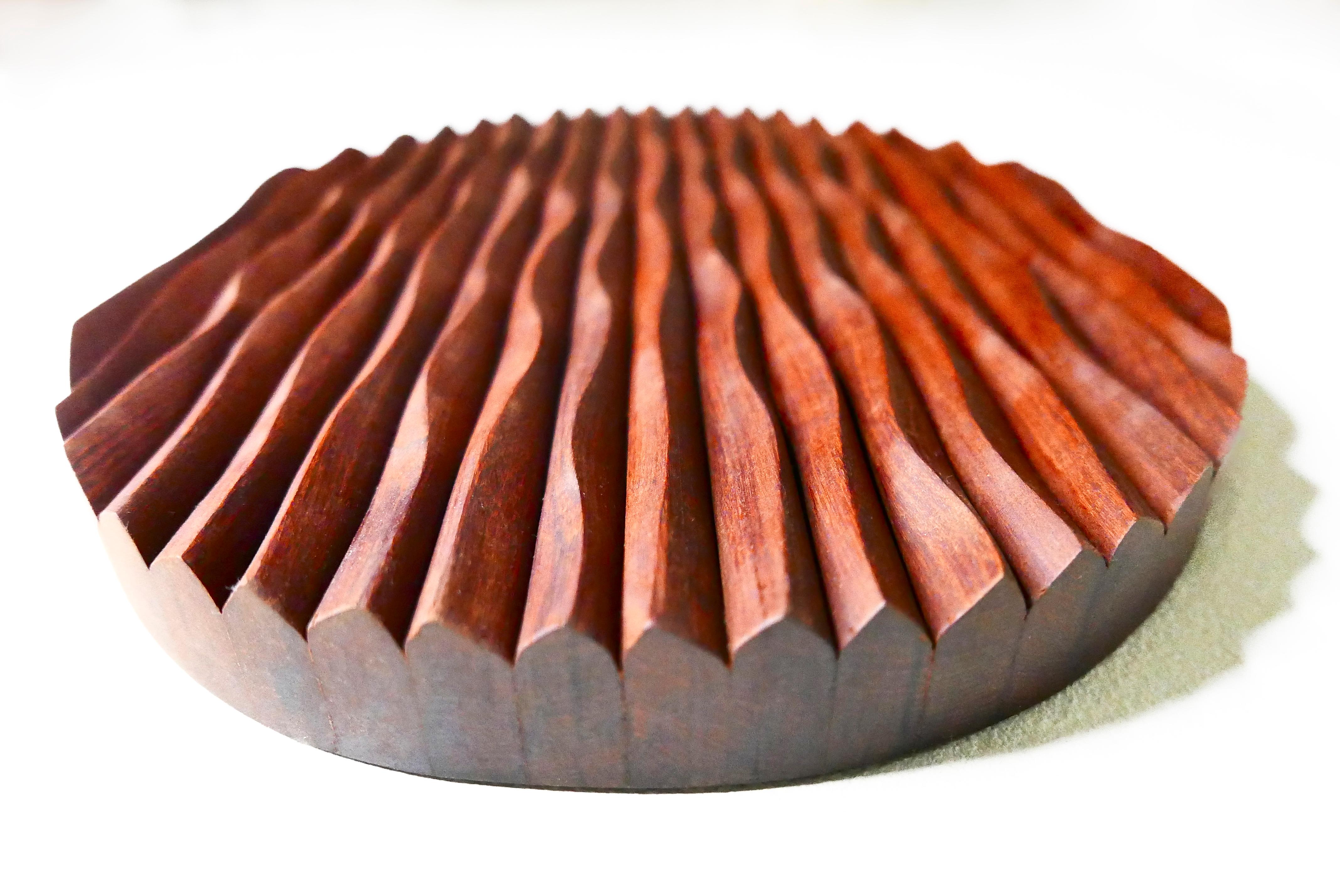 A piece from the 'Ripples' abstract sculpture series by James Rowland made from Brazilian hard wood Ipê.

Scottish Artist and furniture Designer-Maker James Rowland of Knót Artesanal is treading a new path in search of organic forms inspired by