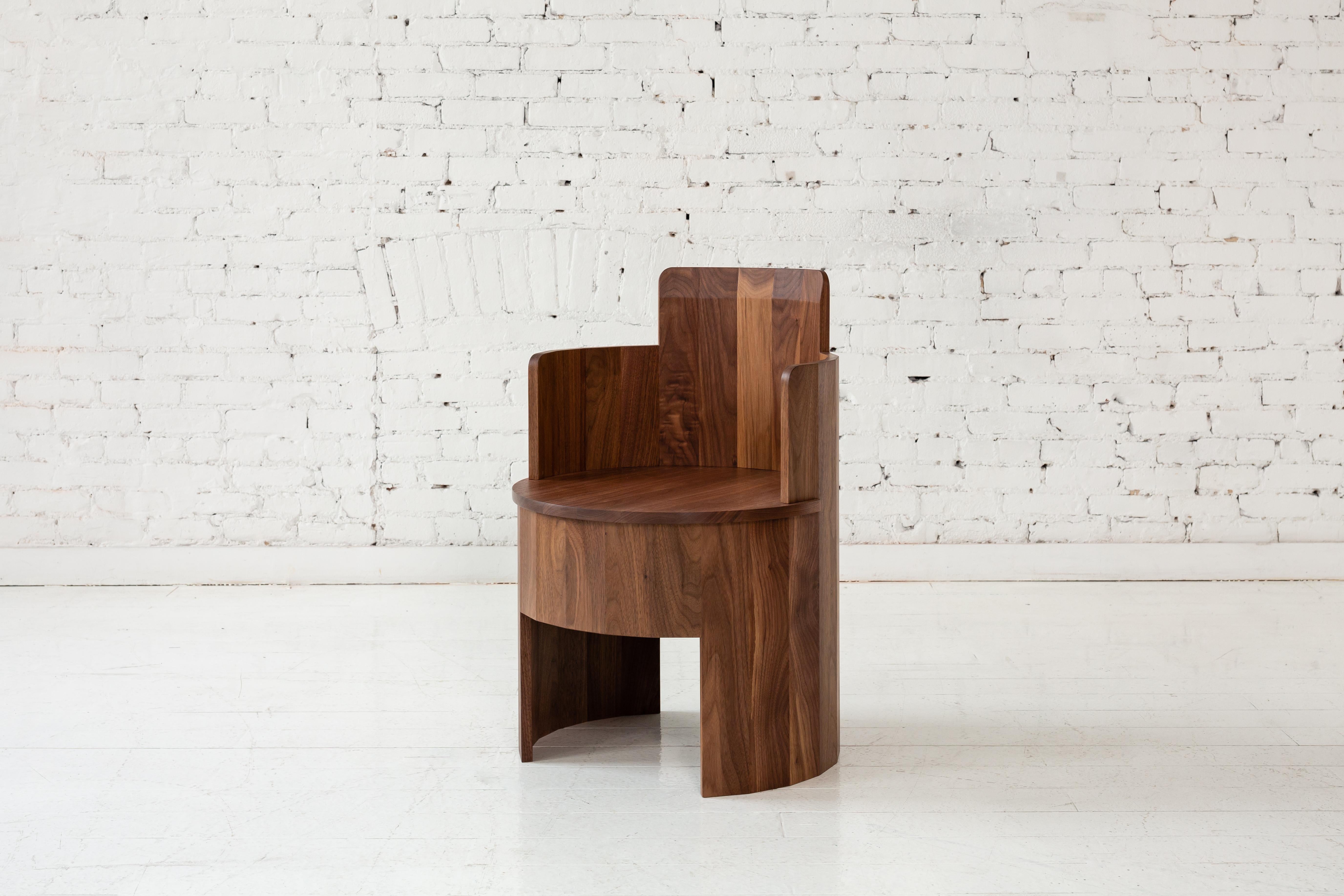 This wood side chair is a part of the new Cooperage Dining collection. Each piece features large faceted round elements that with its namesake reference the traditional cooper's trade of making barrels.

The occasional chair table is shown in