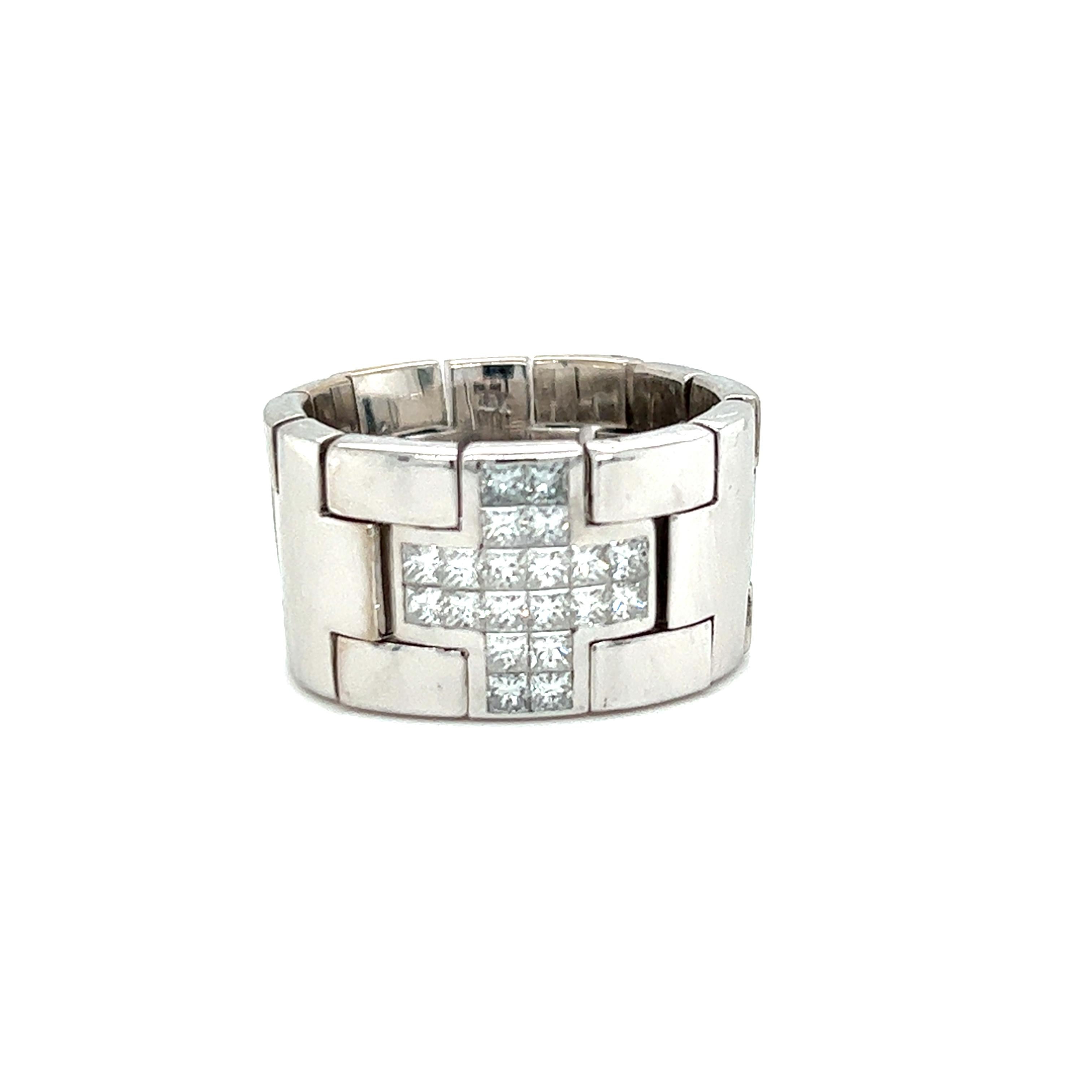 One 18 karat white gold 14.15mm wide link watch band  design ring set with twenty (20) invisible set princess cut diamonds, approximately 1.00 carat total weight with matching H/I color and Si1 clarity. The ring is stamped 
