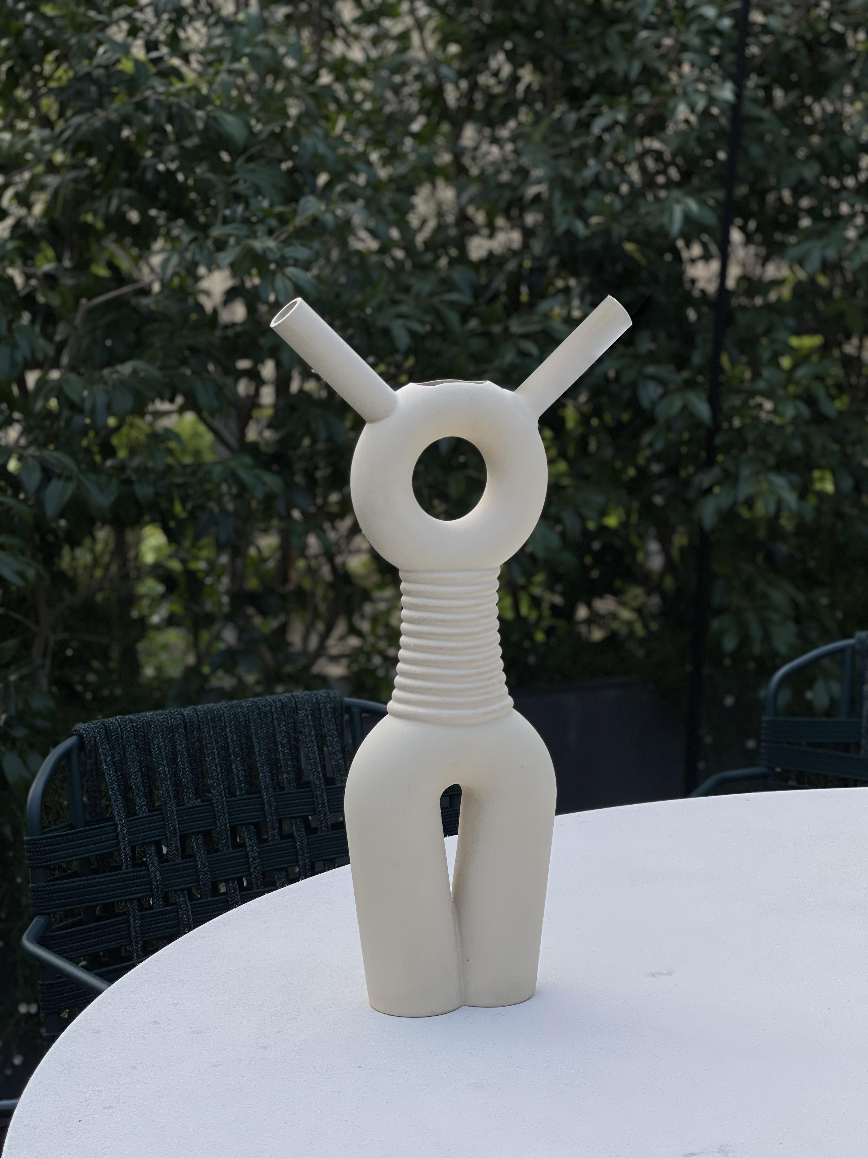 Altea is a handmade ceramic watering can. It has to be filled with water from the head and poured from both horns. With her proud feminine bearing, she is the protector of your plants whether they are indoors or outdoor. 

Dimensions: 51 x 26