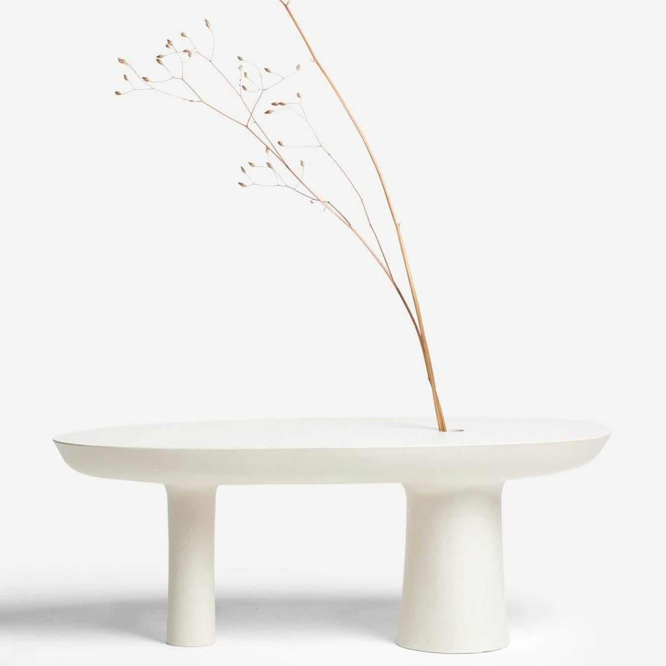 Contemporary white Jesmonite vase - stem vase by Malgorzata Bany

Drawing direct inspiration from the Japanese art of flower arrangement, ‘Ikebana’, the Stem Vase places emphasis on shape, line, form and the texture of the piece. By accentuating a