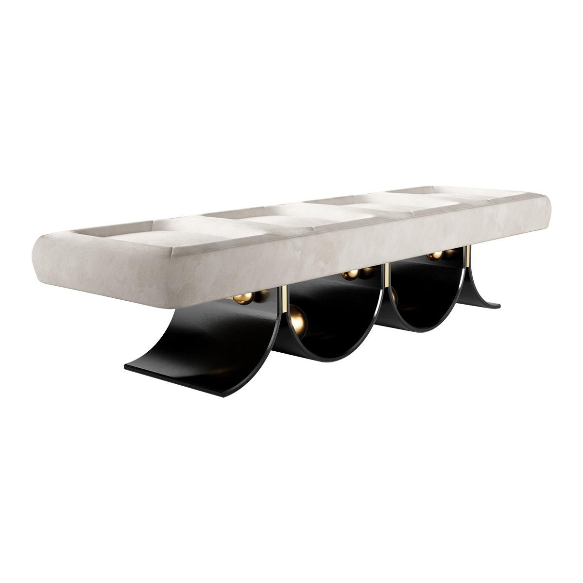 Arcana Bench is an Art Deco-inspired bench that will steal the show in any modern living room project. A luxury bench upholstered in leather with a playful design base with polished brass details.

Materials: Upholstered in Suede; Base in Black