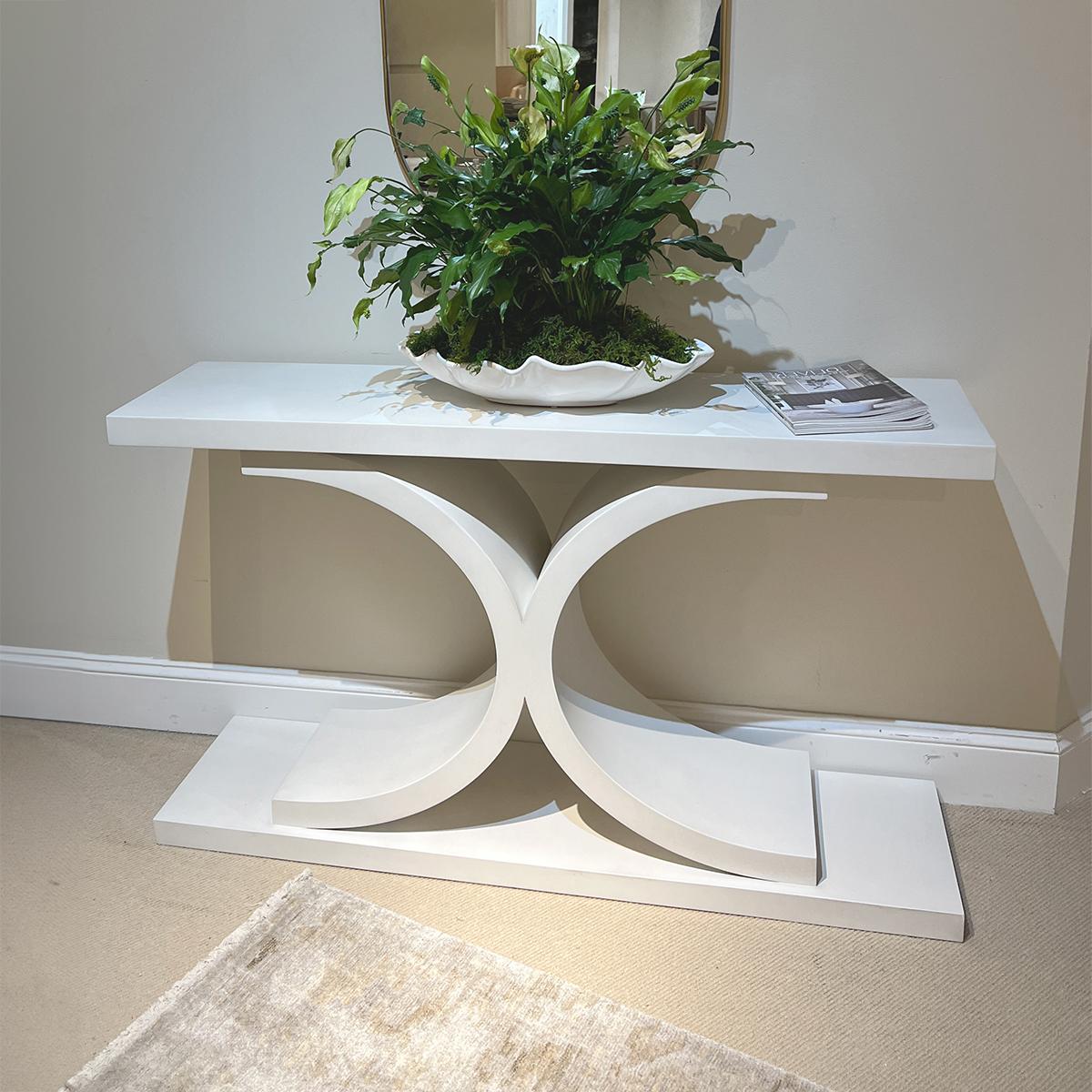 Contemporary White Painted Console with a bold rectangular top, with an unusual incurved C form column raised on a plinth base.

The finish is in the Egret white lacquer with a satin finish.

Dimensions: 54