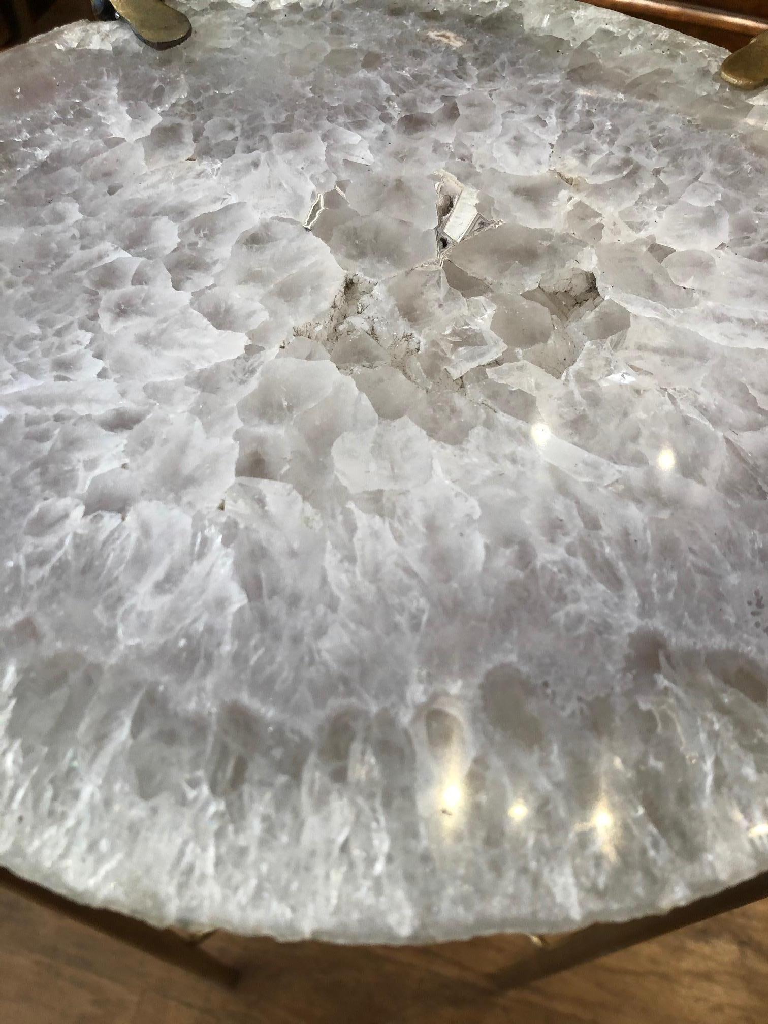 Our gorgeous geode drinks table is a perfect addition to any sitting room especially in an area where the sun hits them just right. Handcrafted with one of a kind quartz slabs and gold gilt metal, this table is available as pictured or can be