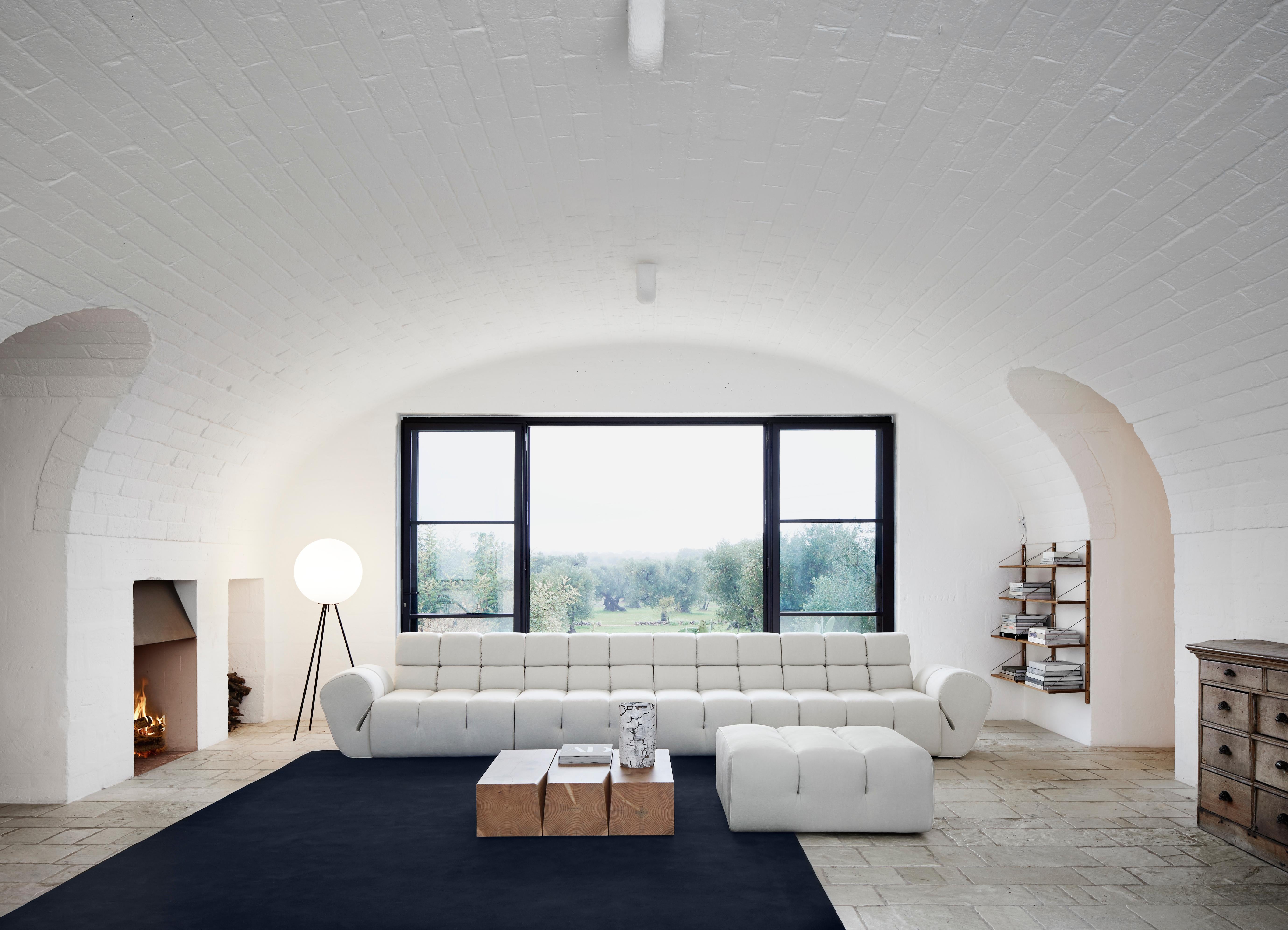 Sectional sofa Palmo by Amura Lab 
Designer: Emanuel Gargano

Model shown: textile - Fibris 03

Inspired by the natural gesture of an opening hand, Palmo is the new living concept designed by Emanuel Gargano.
The leather folds become the