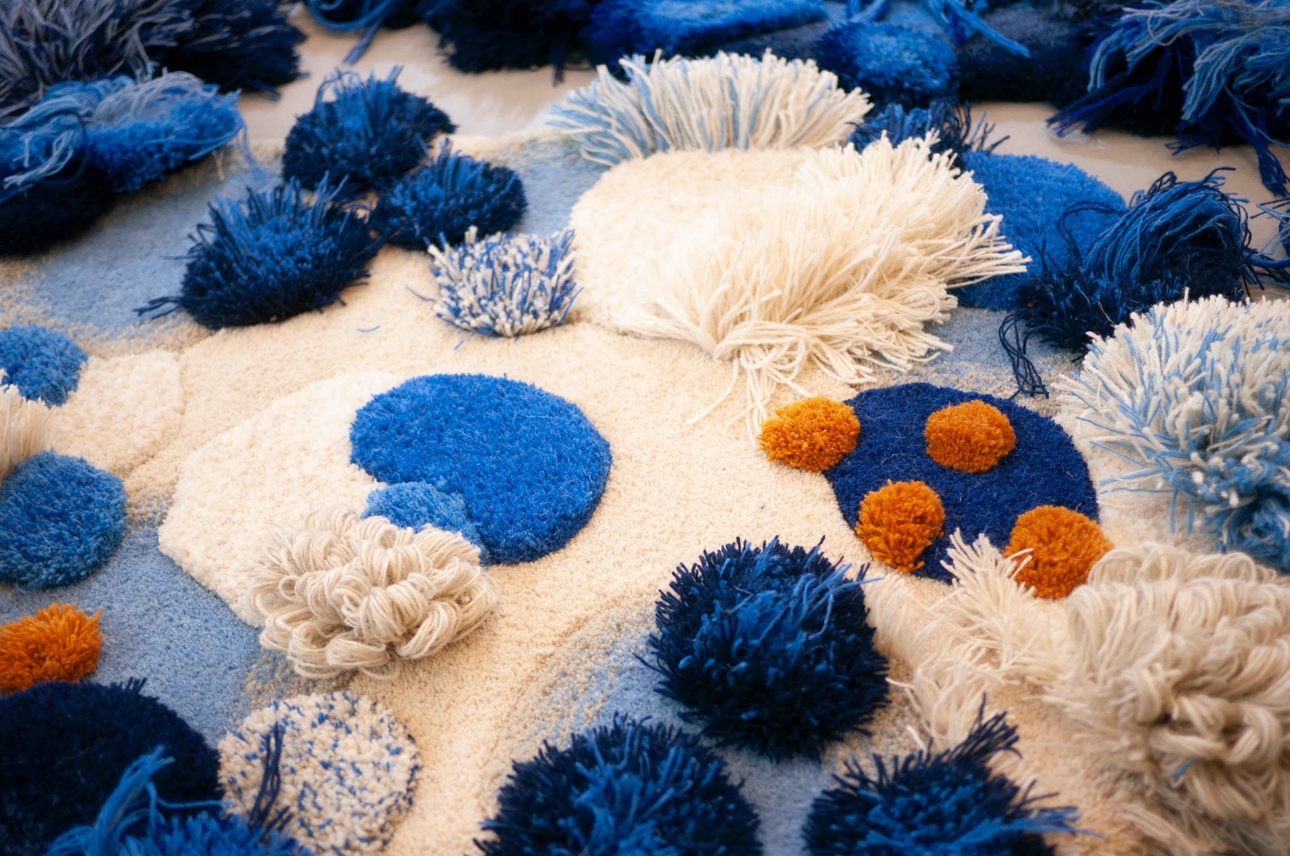 A smaller wool landscape for floor or wall.
Glimpses of positive futures, imagine living with a soft coral reef in your house, the idea that anything is possible creates a hopeful living. White, blue and mustard shades make up this intricately woven