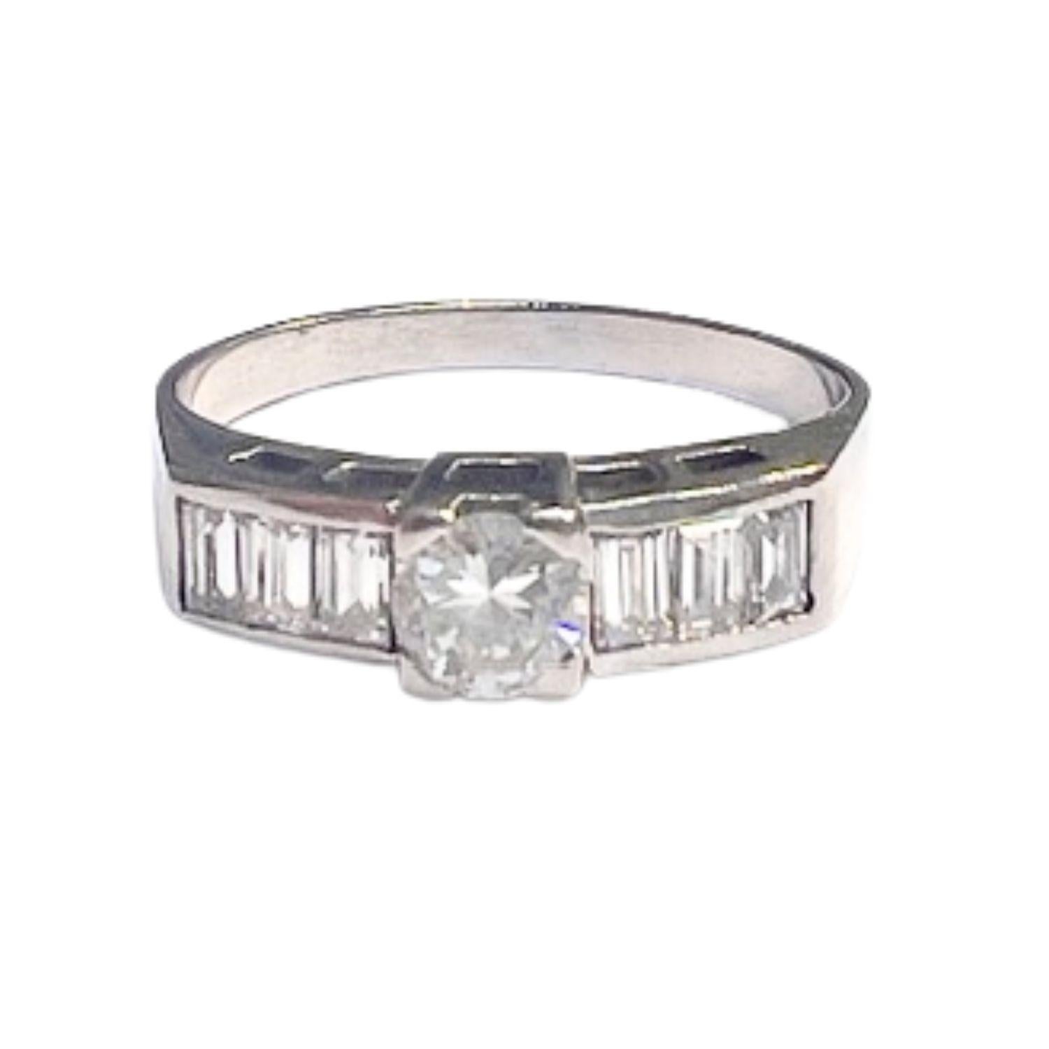 This modern and contemporary ring is crafted from 18k white gold and features a captivating combination of brilliant and baguette cut diamonds. 

With a total diamond weight of 0.61 carats and VS clarity and H-G color, this ring exudes elegance and