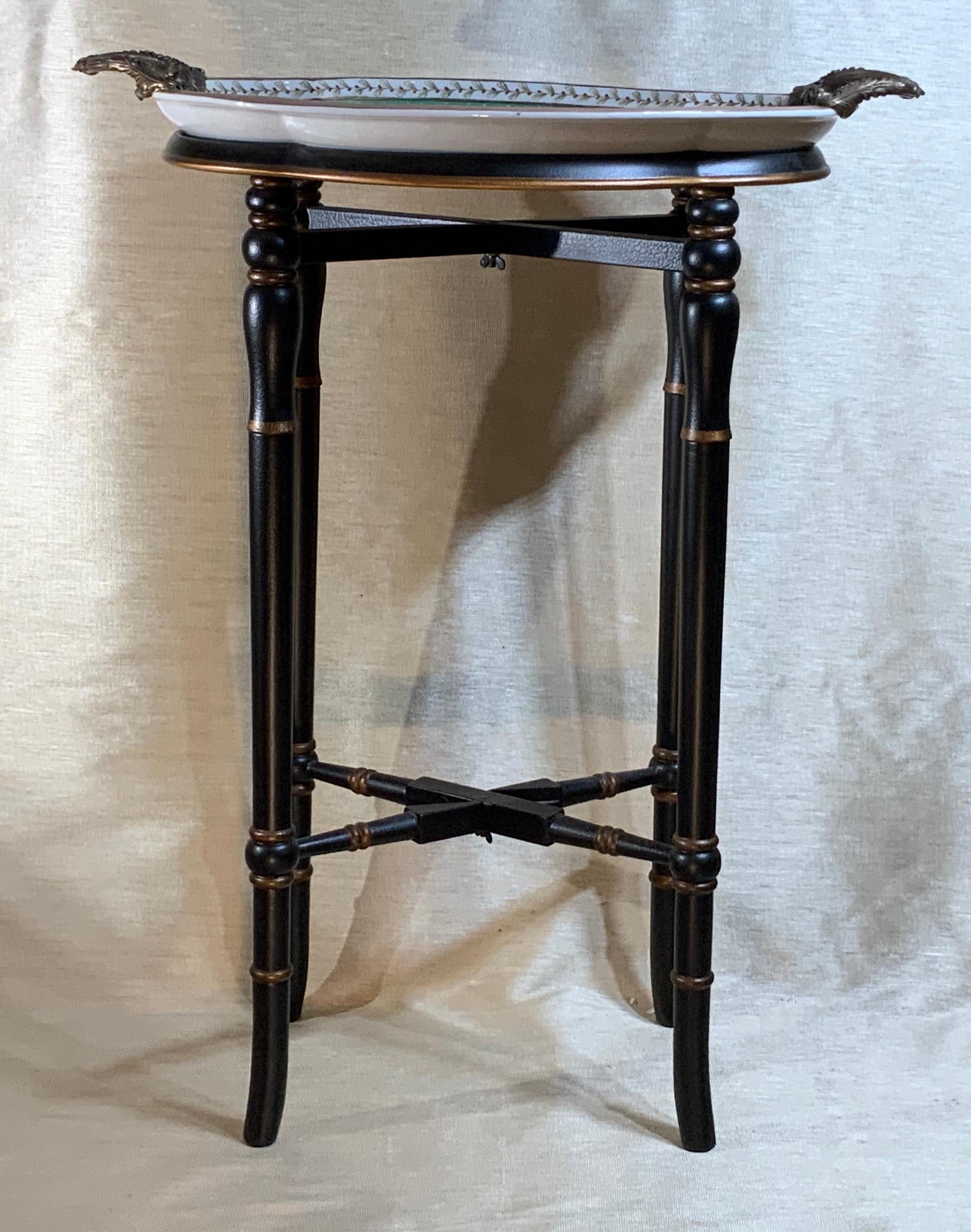Elegant side stand made of four legs wood base, and separate porcelain top tray, that sit on the base, the tray is hand painted of beautiful floral motifs, and Has two bronze handles. Could use as dessert table, side table.
Practical piece of home