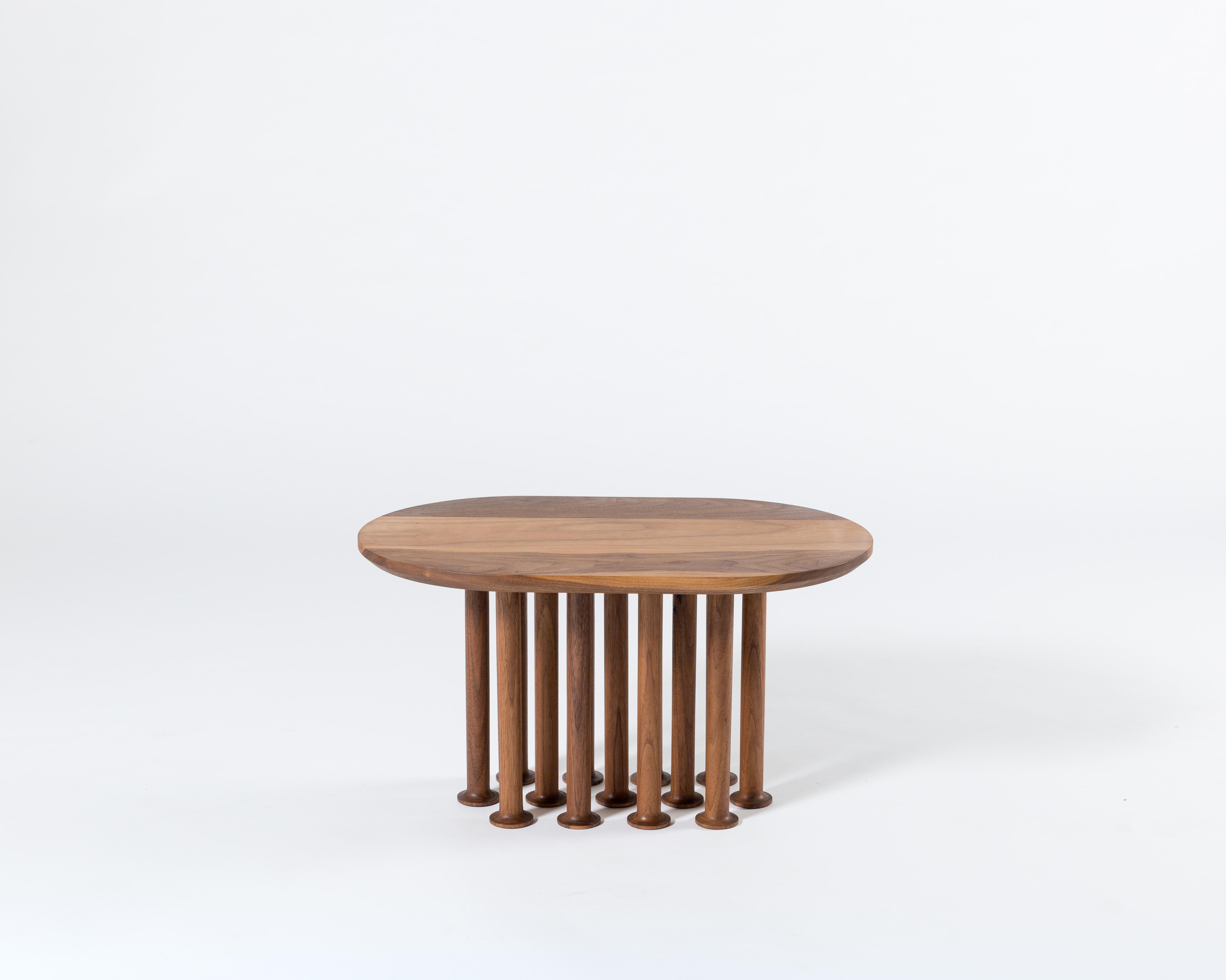 Molinillo is a collection of auxiliary and center tables designed by the Colección Estudio. Each of the legs of the tables were made manually and its intense black color was achieved by carbonizing the wood, a finish inspired by mills. The covers,