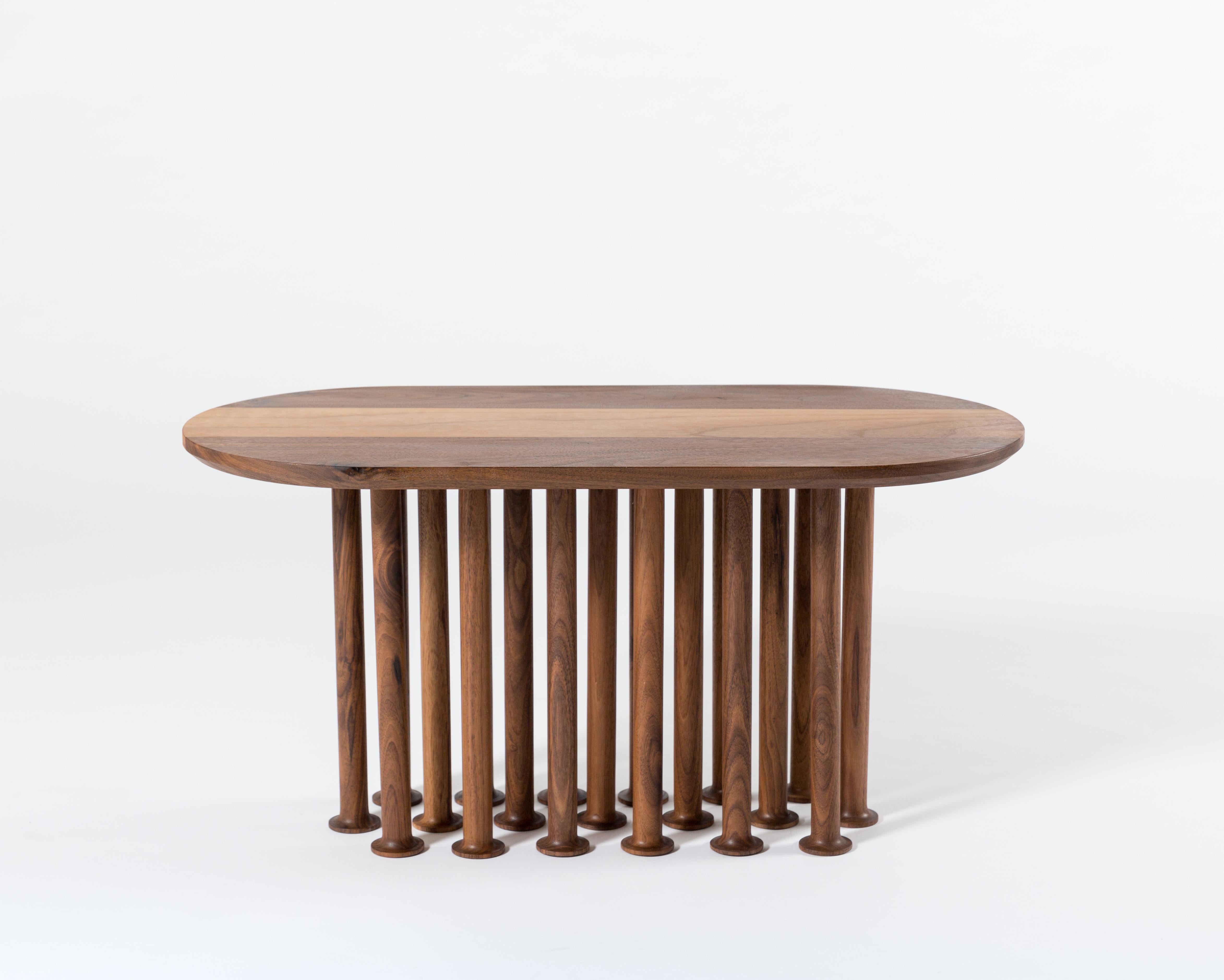 Molinillo is a collection of auxiliary and center tables designed by the Colección Estudio. Each of the legs of the tables were made manually and its intense black color was achieved by carbonizing the wood, a finish inspired by mills. The covers,