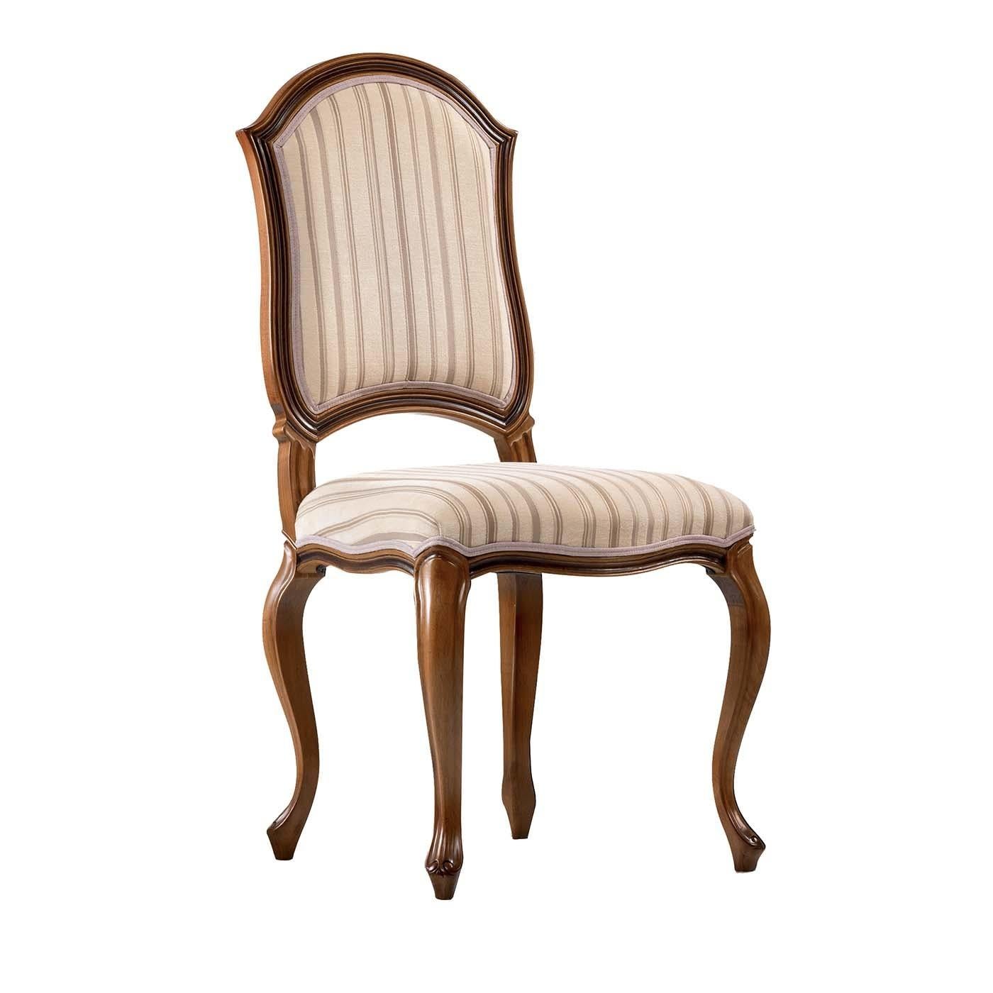 From the creativity and mastery of expert craftsmen comes this Fine dining chair with wooden frame. Belonging to the Contemporary collection, the chair features four Queen Anne style legs. The seat and back are padded and upholstered in a striped