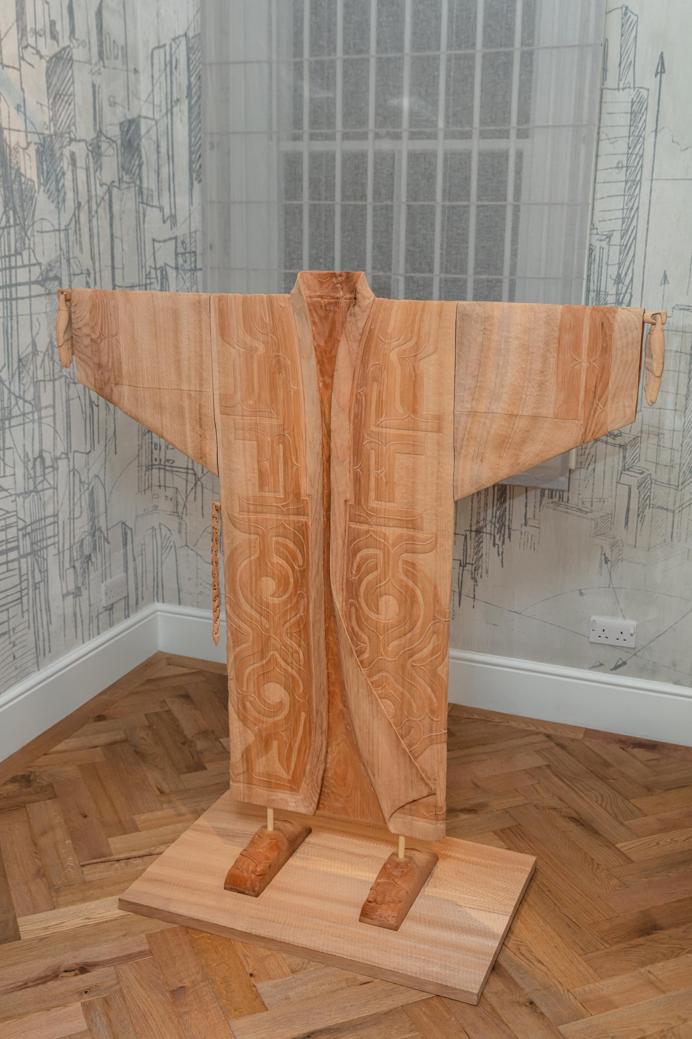 This hand-carved wooden kimono sculpture is a contemporary piece of art made by award-winning artist Toru Kaizawa. Entitled “Hagi”, this piece was created in collaboration with SoShiro gallery for the Ainu collection. It celebrates the artistry of