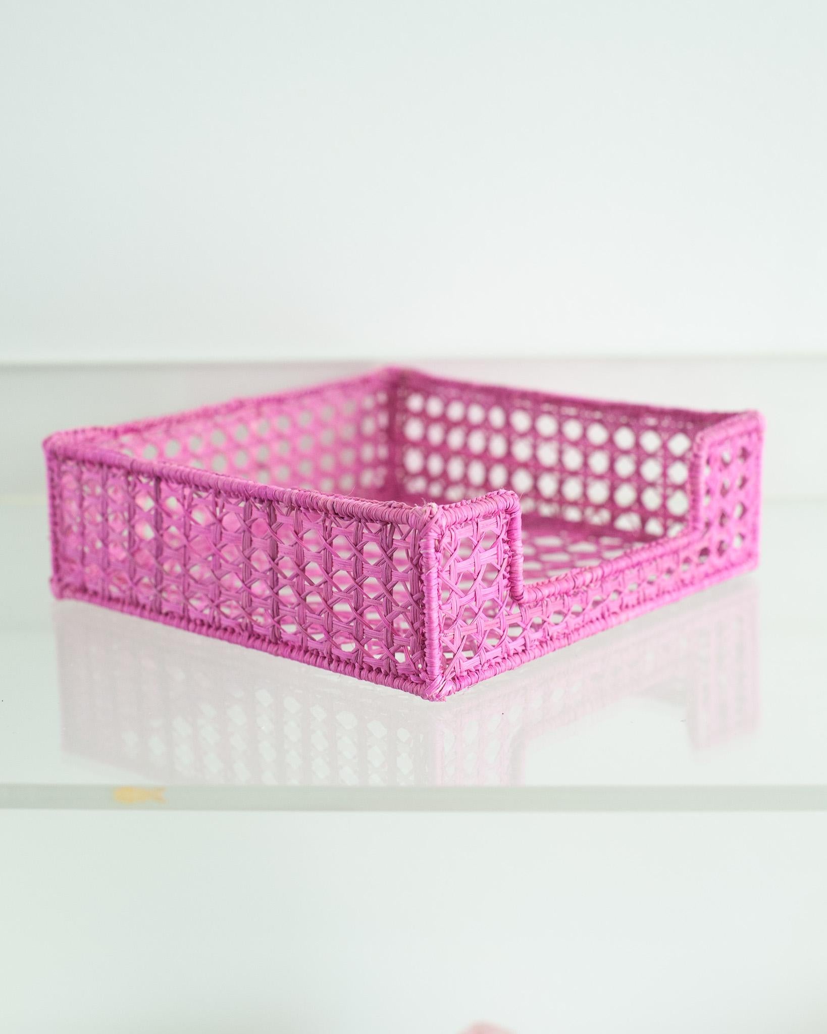 Uplift your table with this stunning handwoven rattan napkin holder. Finely crafted by expert artisans, this piece showcases the classical technique of weaving in a modern way. From Jean Michel Frank to the House of Dior, rattan has always had a