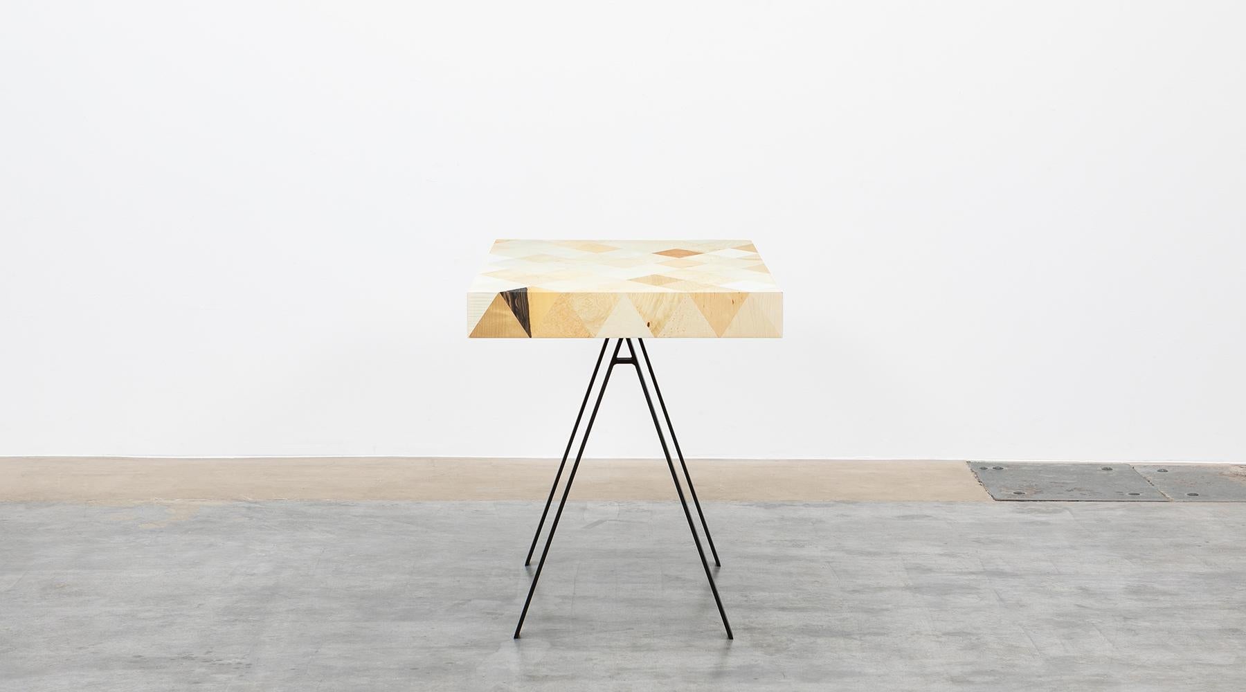 Stunning writing desk by contemporary German Artist Johannes Hock. 
A well proportioned body situated on a metal base. The surface of rhombs, joined in different veneers, apparently flowing over the table edges. Manufactured by Atelier Johannes