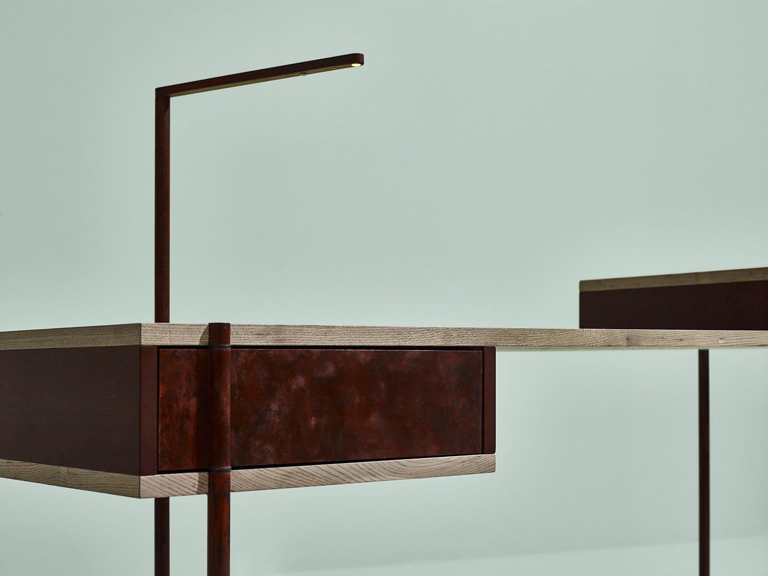 Sem Pivot collection, writing desk, simple and sculptural. The supporting structure is a rigid system of metal tubes to which are added shelves in beautiful stone elmwood and Canaletto walnutwood combined with various lacquered containers. The