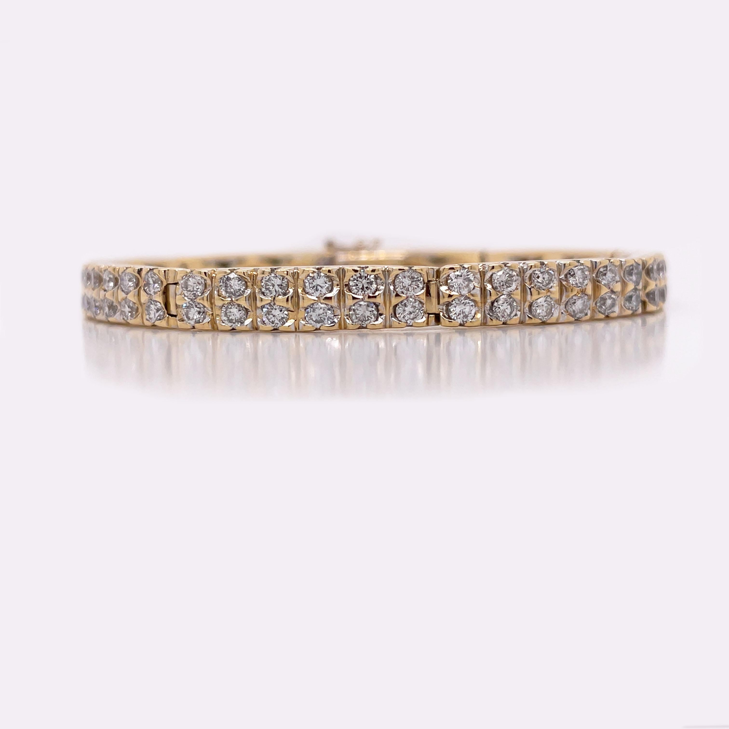 This is a beautiful Contemporary Diamond Bar Bracelet set in 18K Yellow Gold! This bracelet is essential to any woman's jewelry wardrobe! Set in 18K Yellow Gold, this bracelet is composed of 98 diamonds with an approximate weight of 4.18 cttw! Can