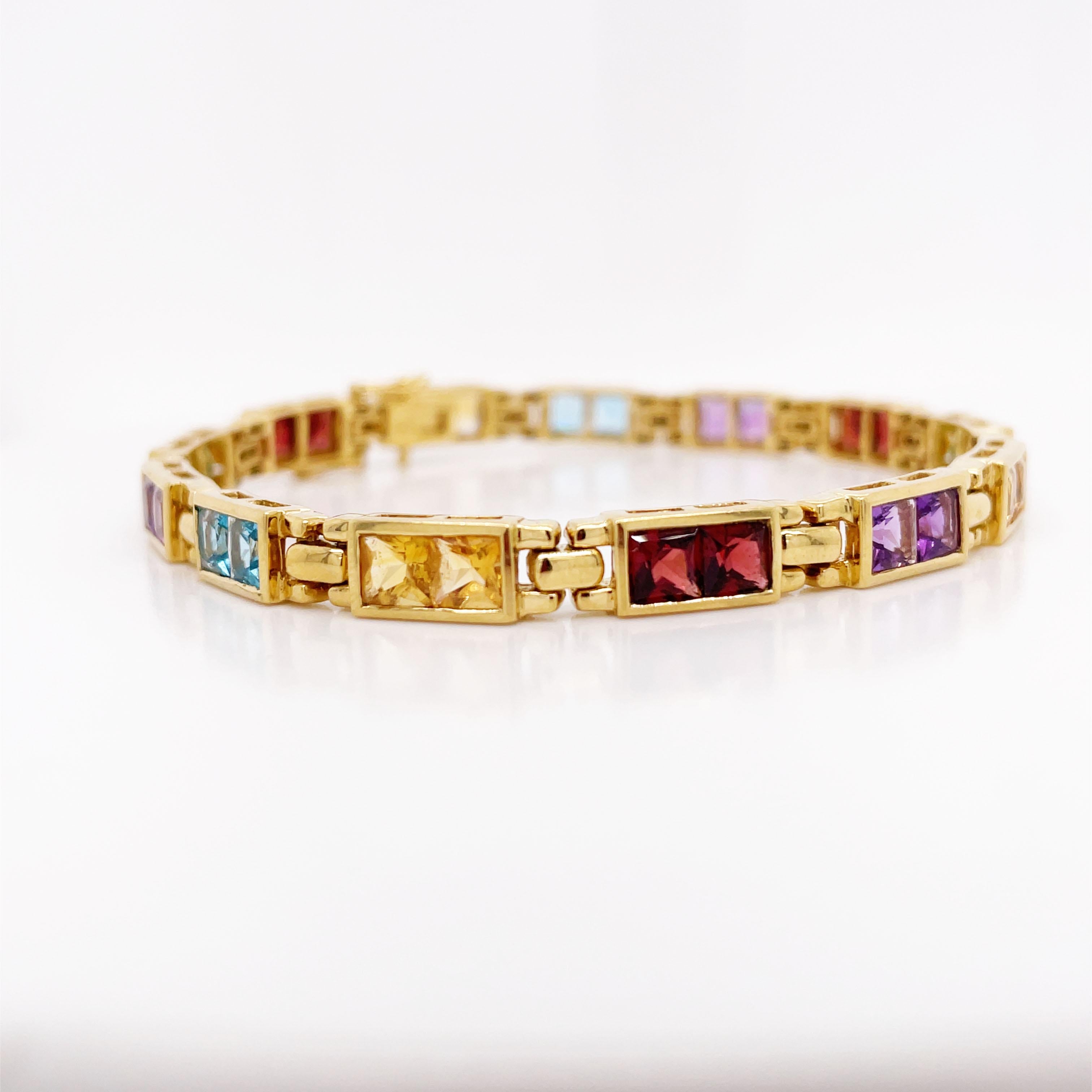 This is a splendid Contemporary line bracelet set in 18K yellow gold featuring a gorgeous array of beautiful colored gemstones! This bracelet is perfect for everyday wear and beautiful and colorful addition to your jewelry wardrobe! This line