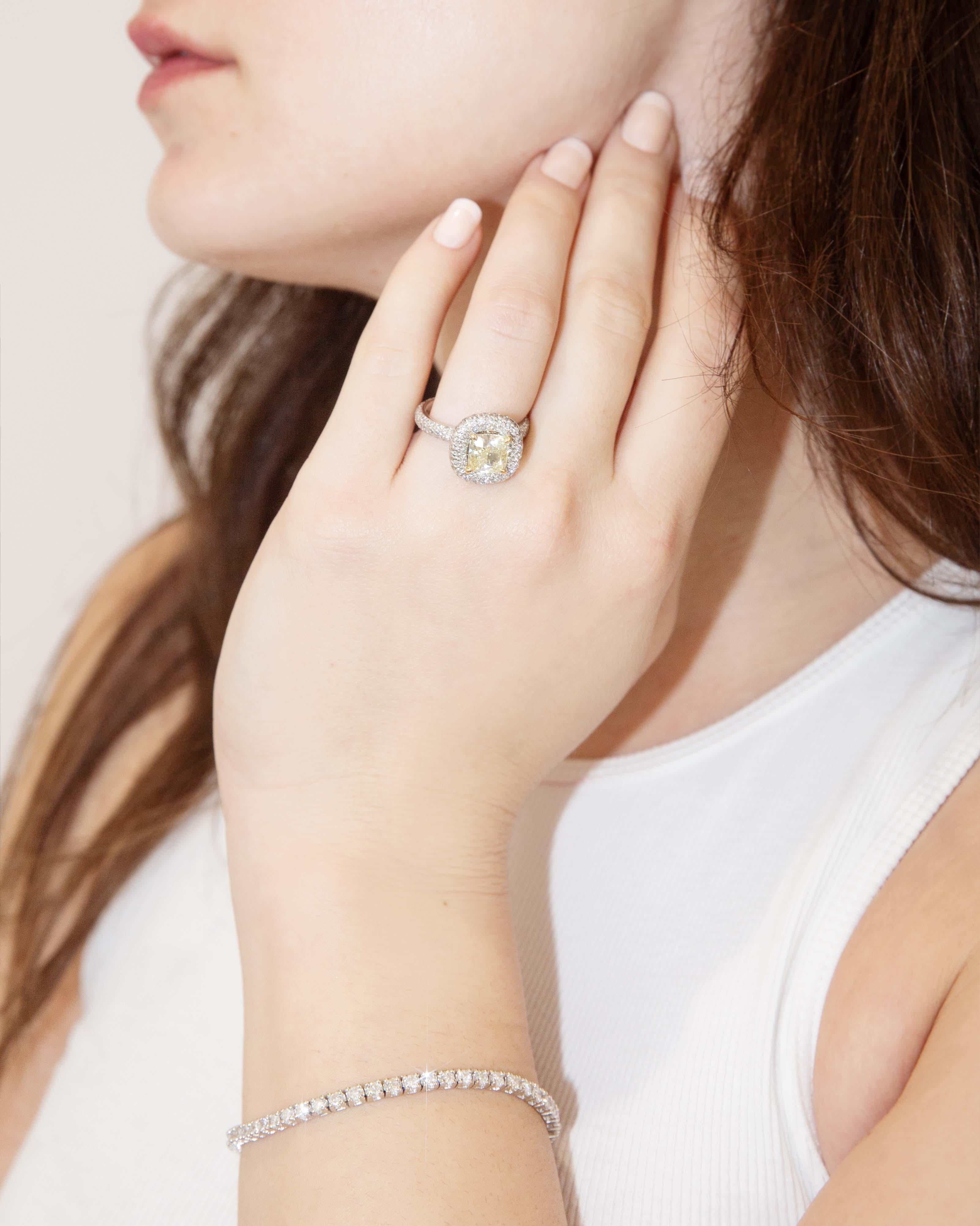 Wrapped in the embrace of 18 carat white gold, the Portia yellow & pave White diamond ring radiates joy like sunlight dancing on morning dew. Each diamond sparkles with a story, illuminating the warmth of love and celebration. Wear it, and feel the