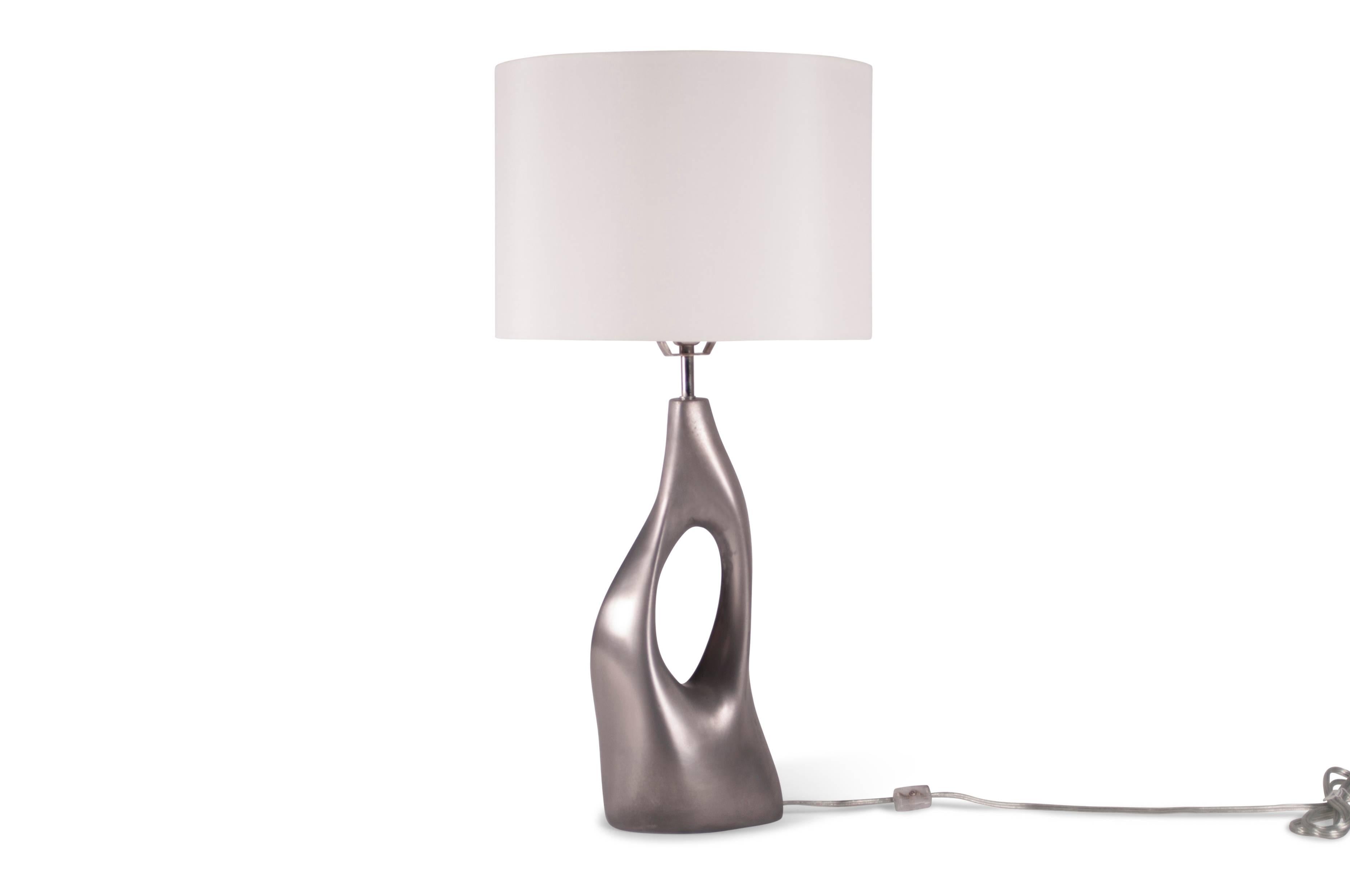 sculptural table lamp made from MDF with Cold Metal finish. Color: White Gold 
Dimension base: 16