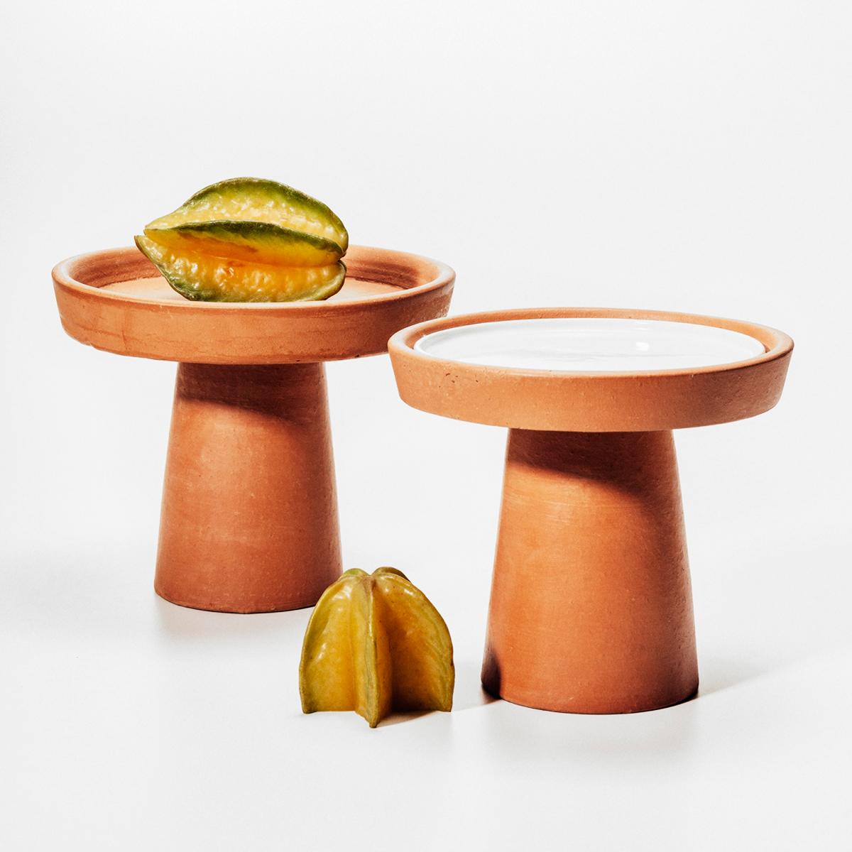 Designed by Brunno Jahara, contemporary Brazilian design, Clay, Brazil, 2014.

Set of trays with two different sizes, large and medium. The base rises and expands into a plate shape. 

Measures: Large tray 1 level, H 10, 24 in. x Ø 7, 48 in., H