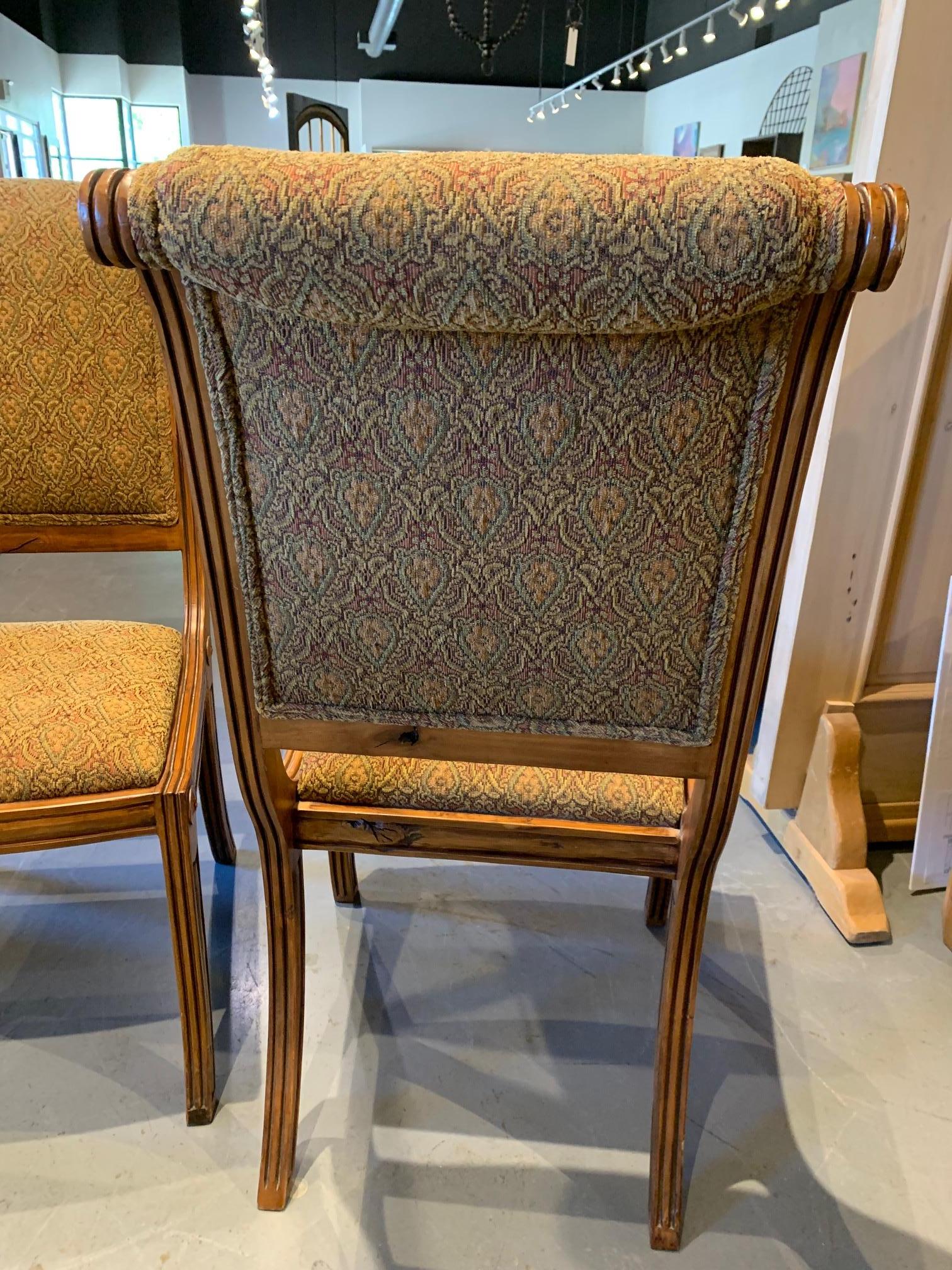 Timeless Ernest Thompson side chairs. Beautifully upholstered with hand carved details.
Made in Alder with a custom finish.

These are showroom floor models and that show some wear.