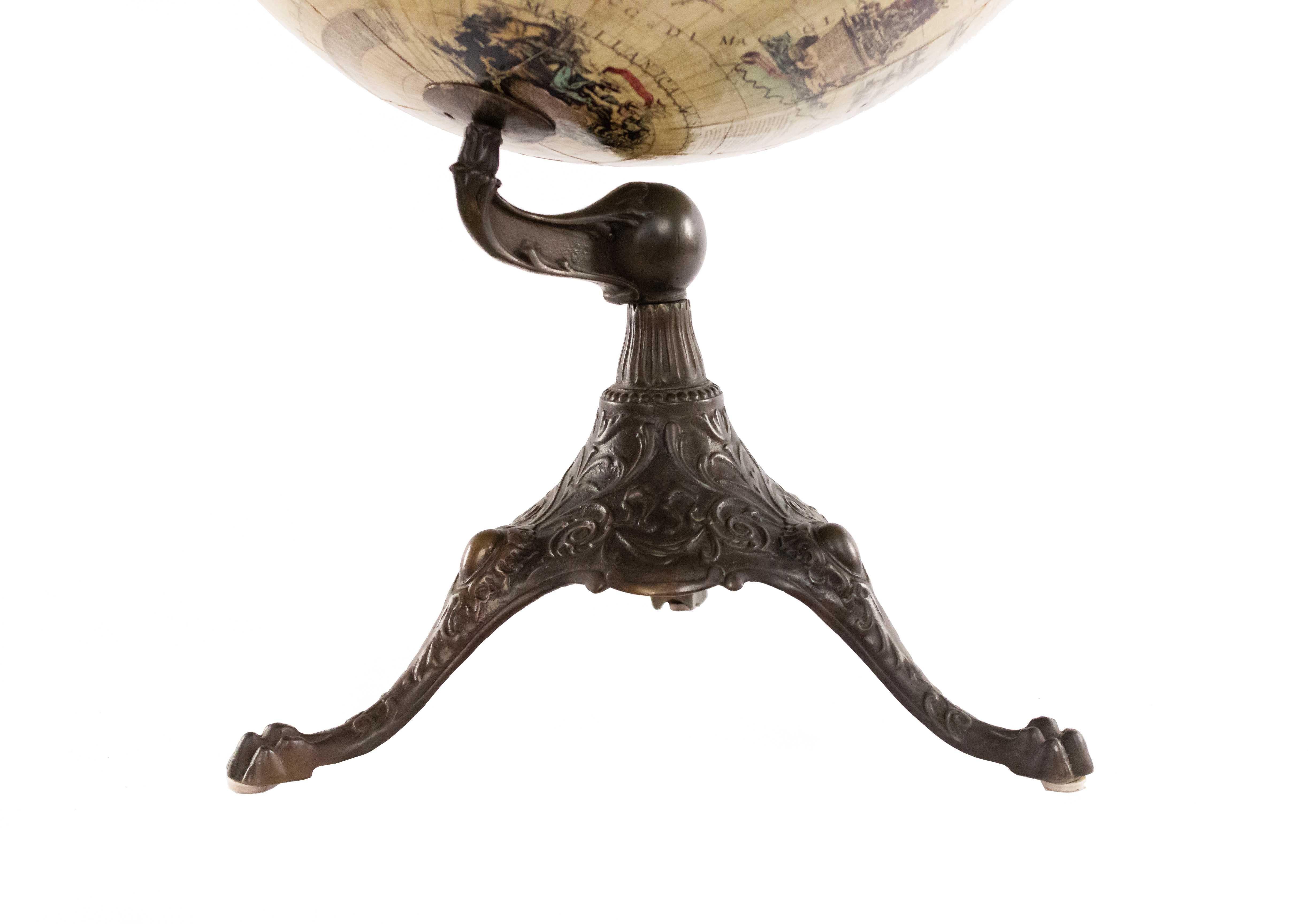 Continental 17th Century-style globe of the world supported on an iron 3 legged base.