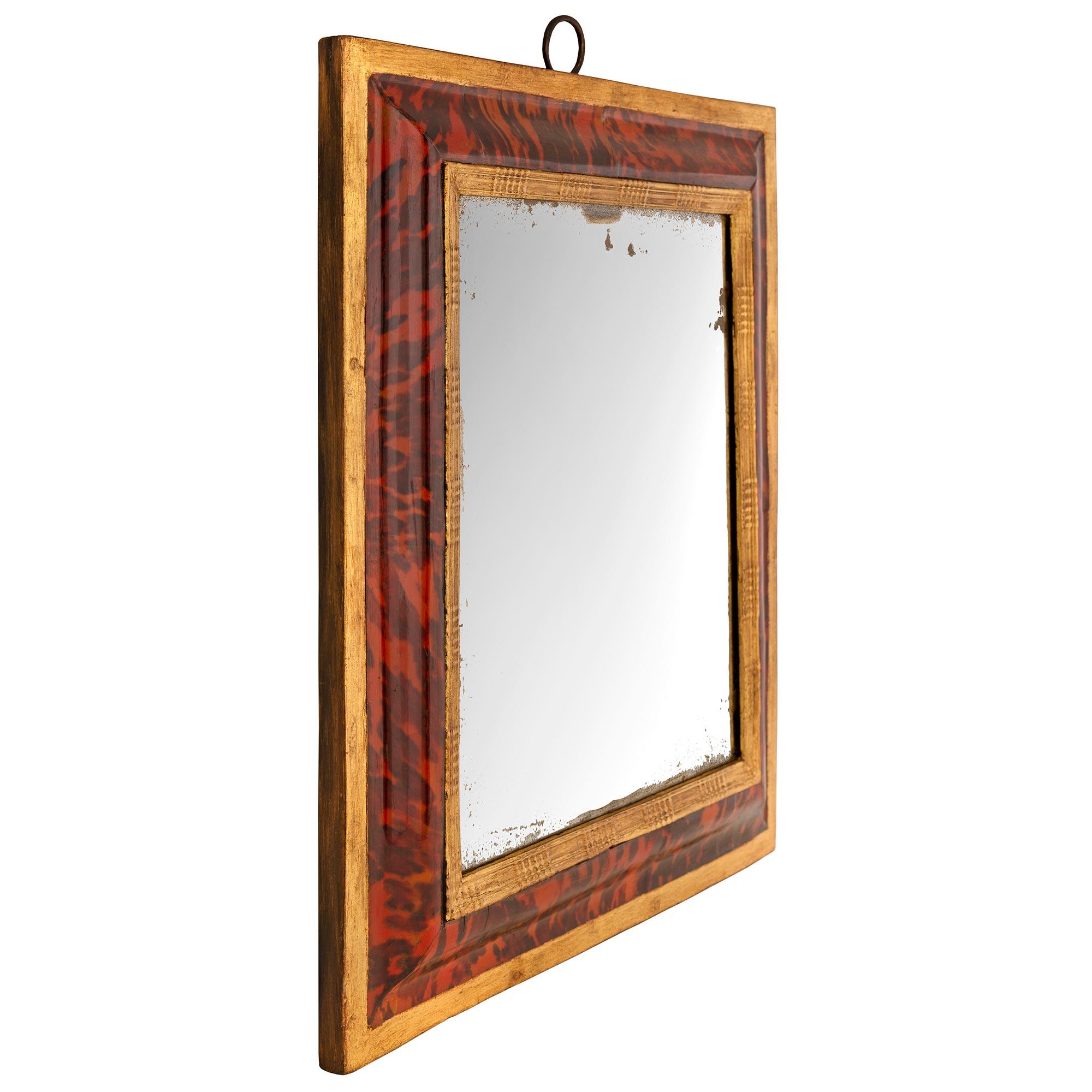 A striking Continental 18th century Tortoiseshell and giltwood mirror. The original mirror plate is set within a beautiful mottled giltwood border with a fine tortoiseshell frame with an elegant giltwood band. All original gilt and mirror plate
