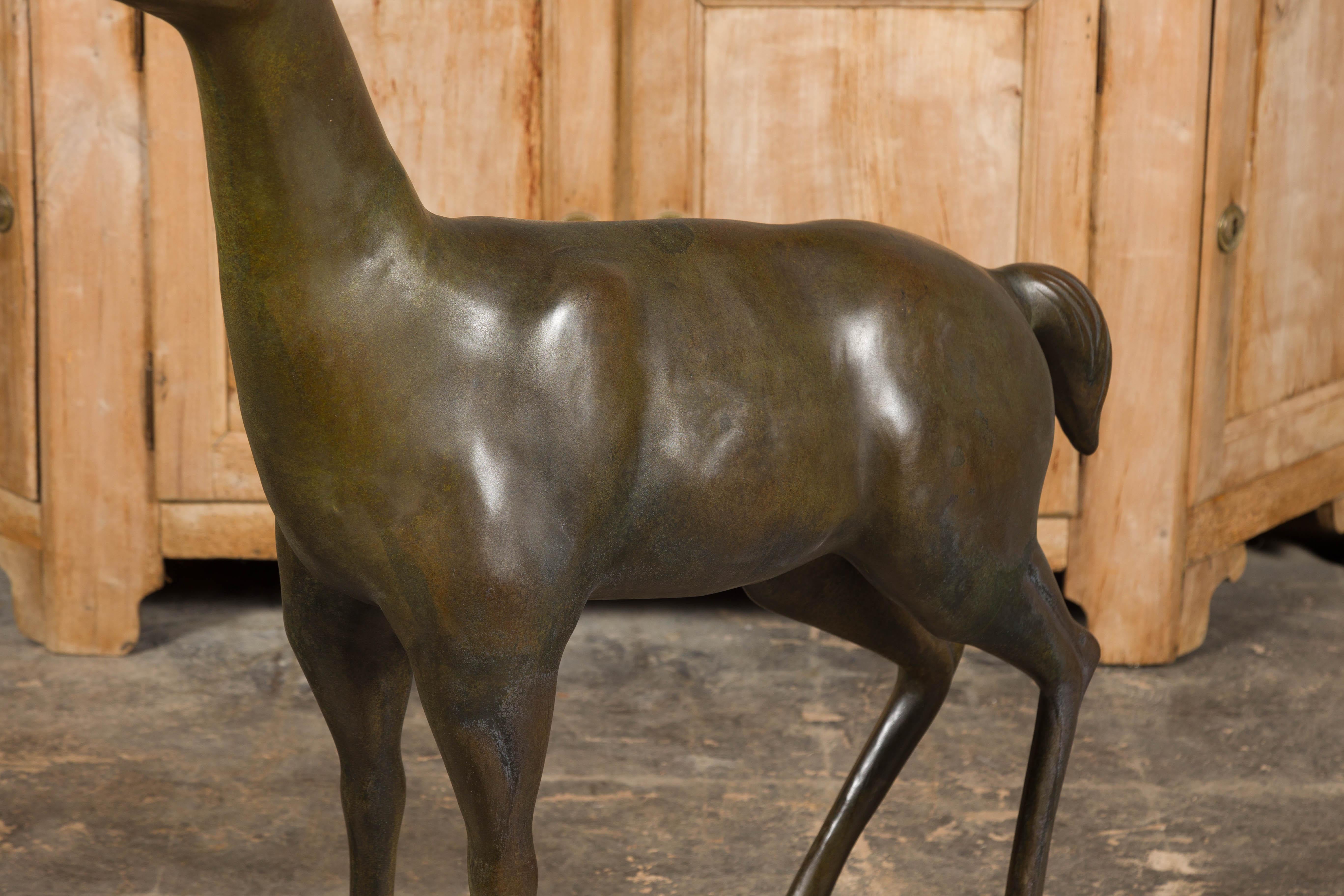 European Continental 1930s Life Size Bronze Sculpture of a Deer Standing on its Four Legs For Sale