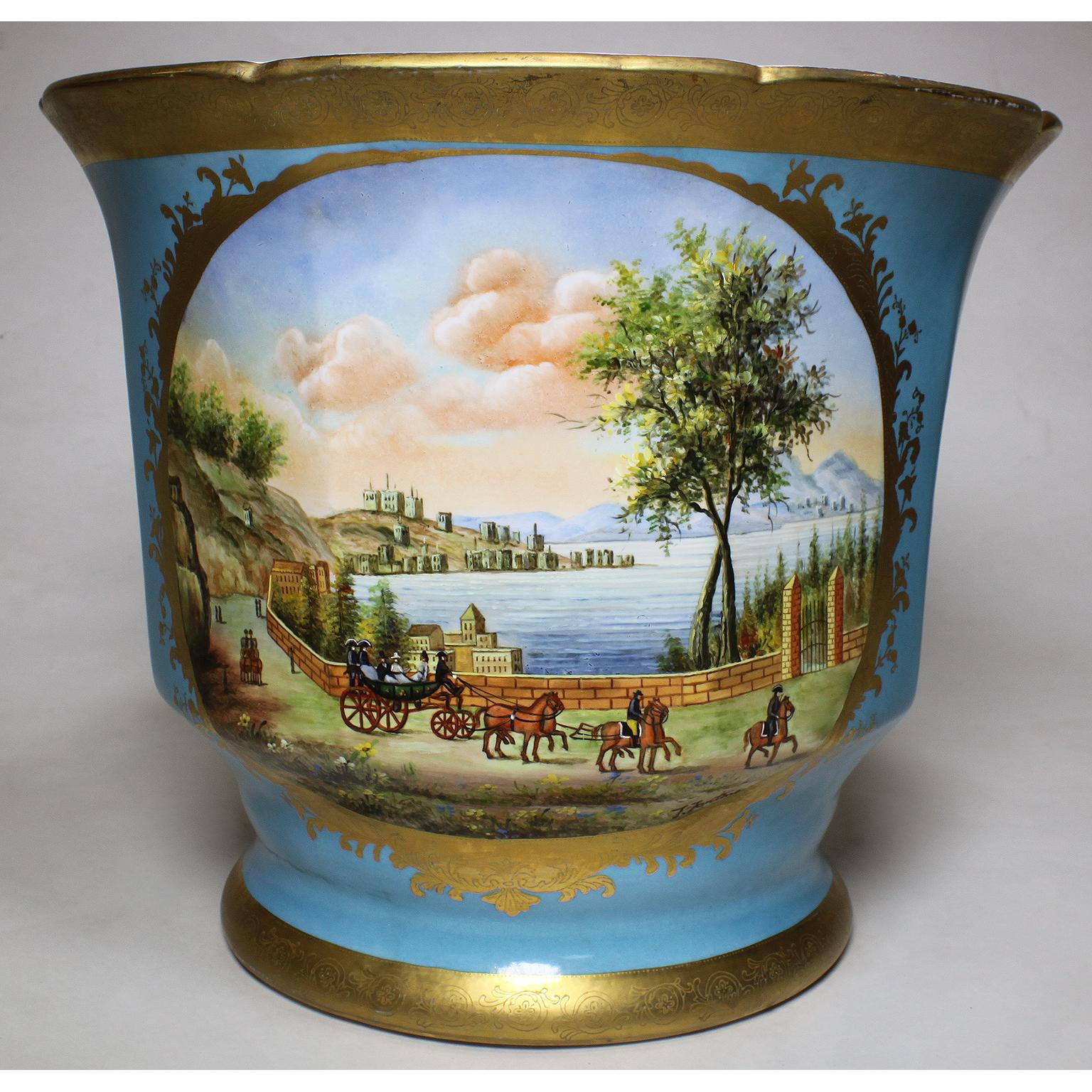 A large pair of continental 19th-20th century porcelain cachepot vases, Planters or Wine Coolers, each decorated with mountain and lakefront scenes with horse drawn carriages and a parcel gilt trim and decorations and a bleu celeste (blue) ground