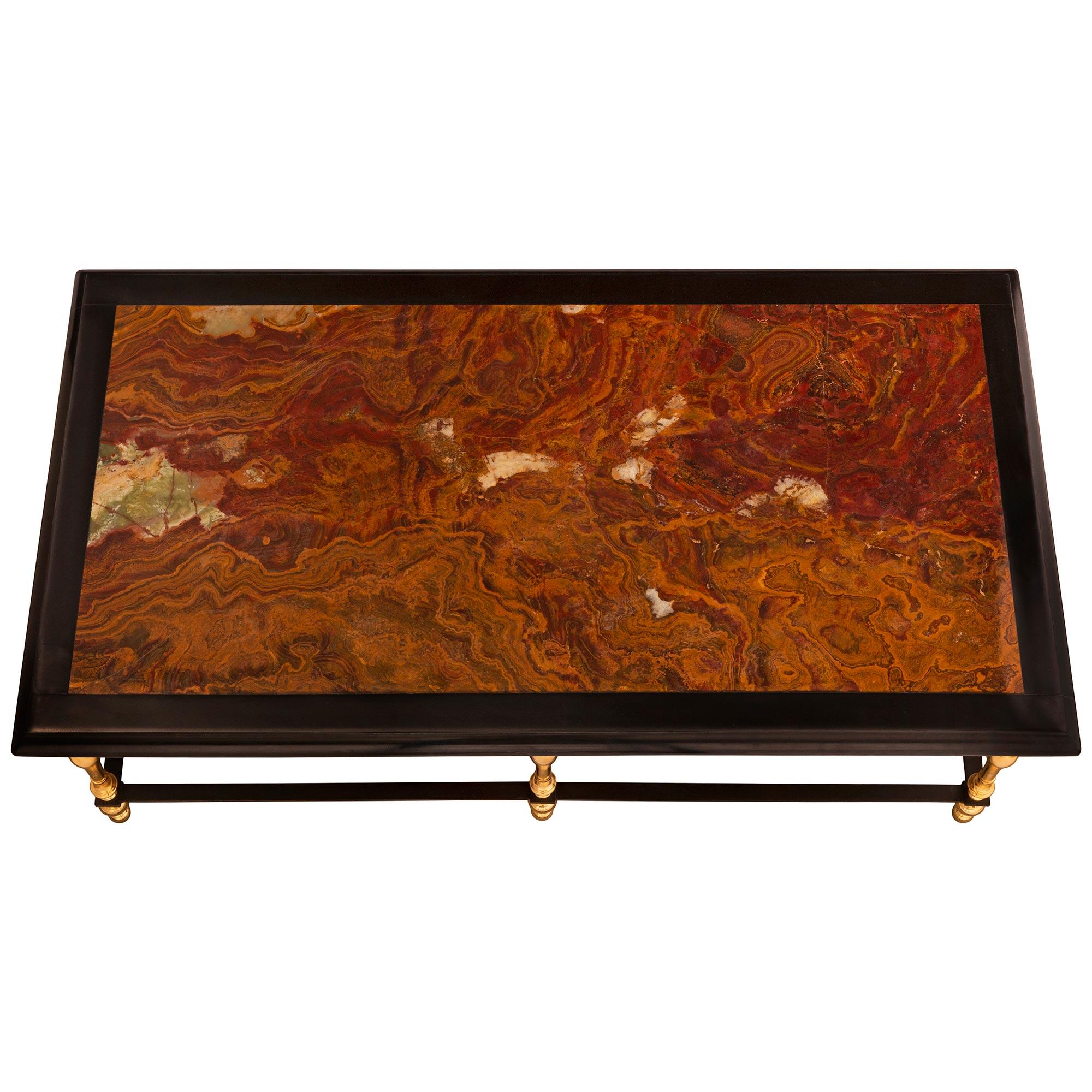 A beautiful Continental 19th century Louis XIV st. ormolu, patinated bronze, Alabastro and black Belgian marble coffee table. The rectangular coffee table is raised by six elegant and most decorative turned ormolu supports with baluster shapes and
