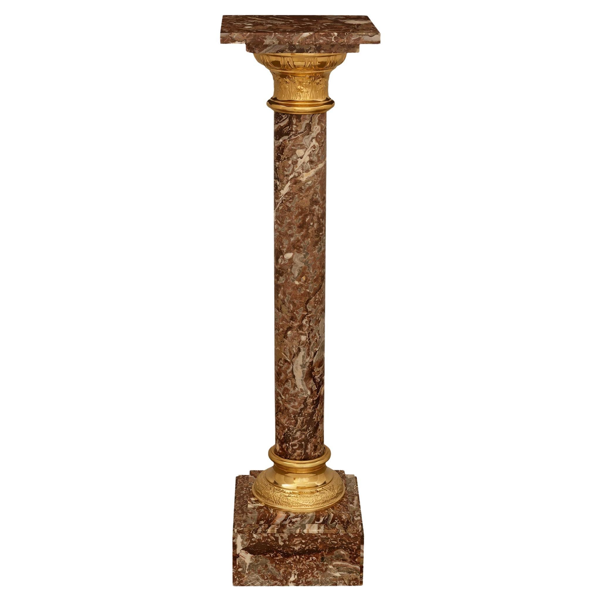 Continental 19th century Louis XVI st. Ormolu and Rouge Royale marble pedestal