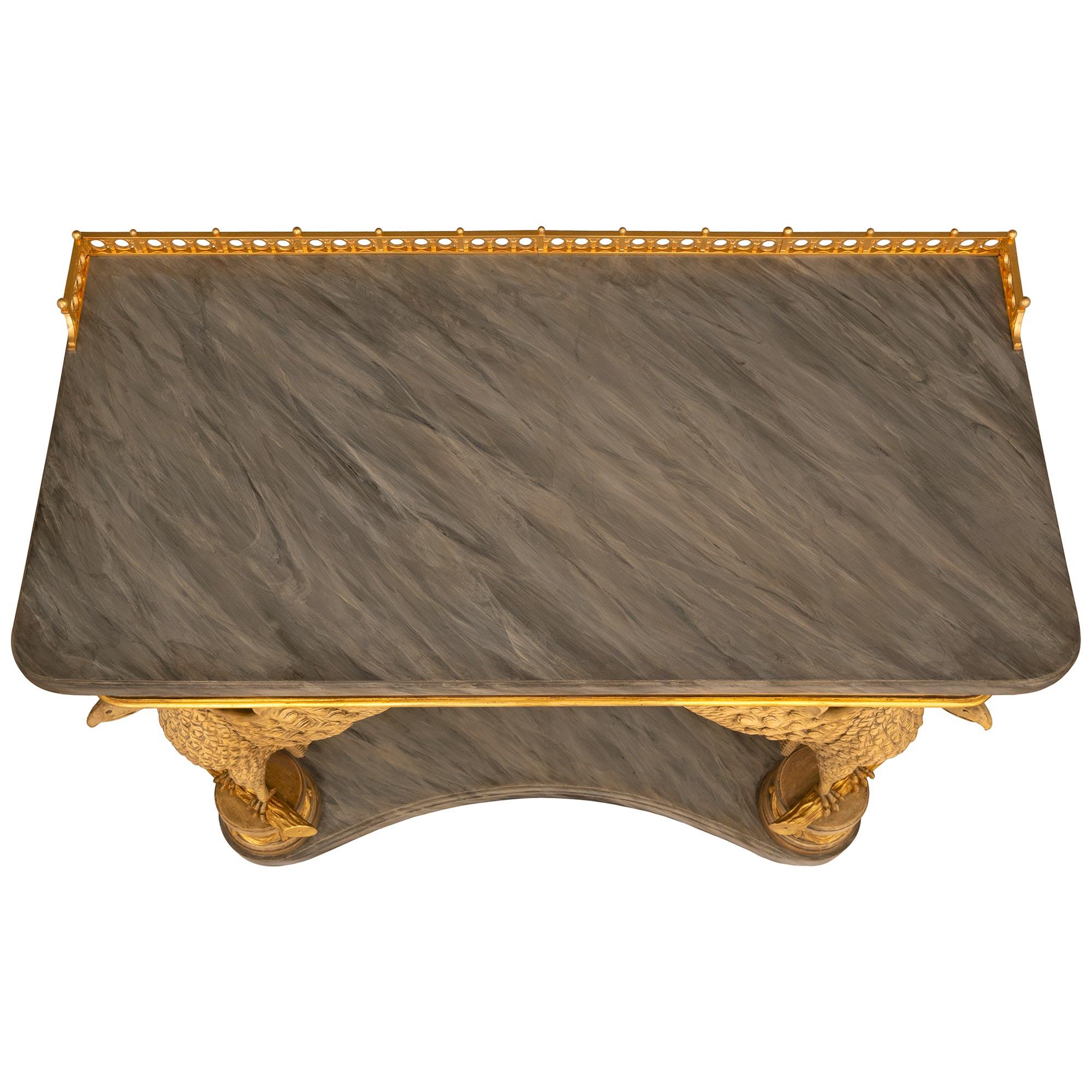 A most unique and extremely decorative Continental 19th century Neo-Classical st. patinated wood, faux painted marble and Giltwood console. The freestanding console is raised by a faux Gris St. Anne marble base with a mottled border. Above are two