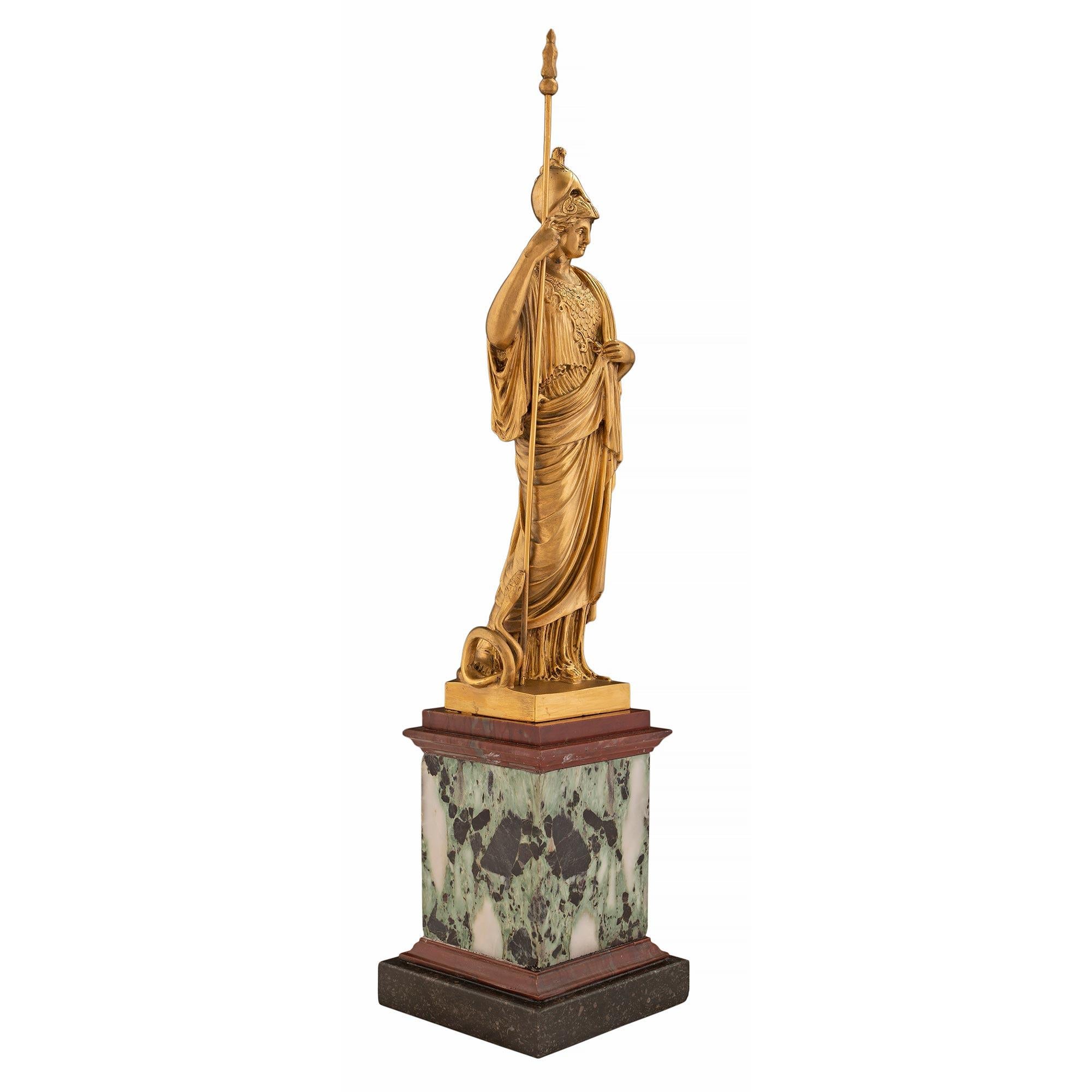 A most decorative and high quality Continental 19th century neo-classical st. ormolu and marble statue of Athena. The statue is raised by a plinth with a bottom Occhio di Pavone marble base below the Verde Antico marble column which is flanked by