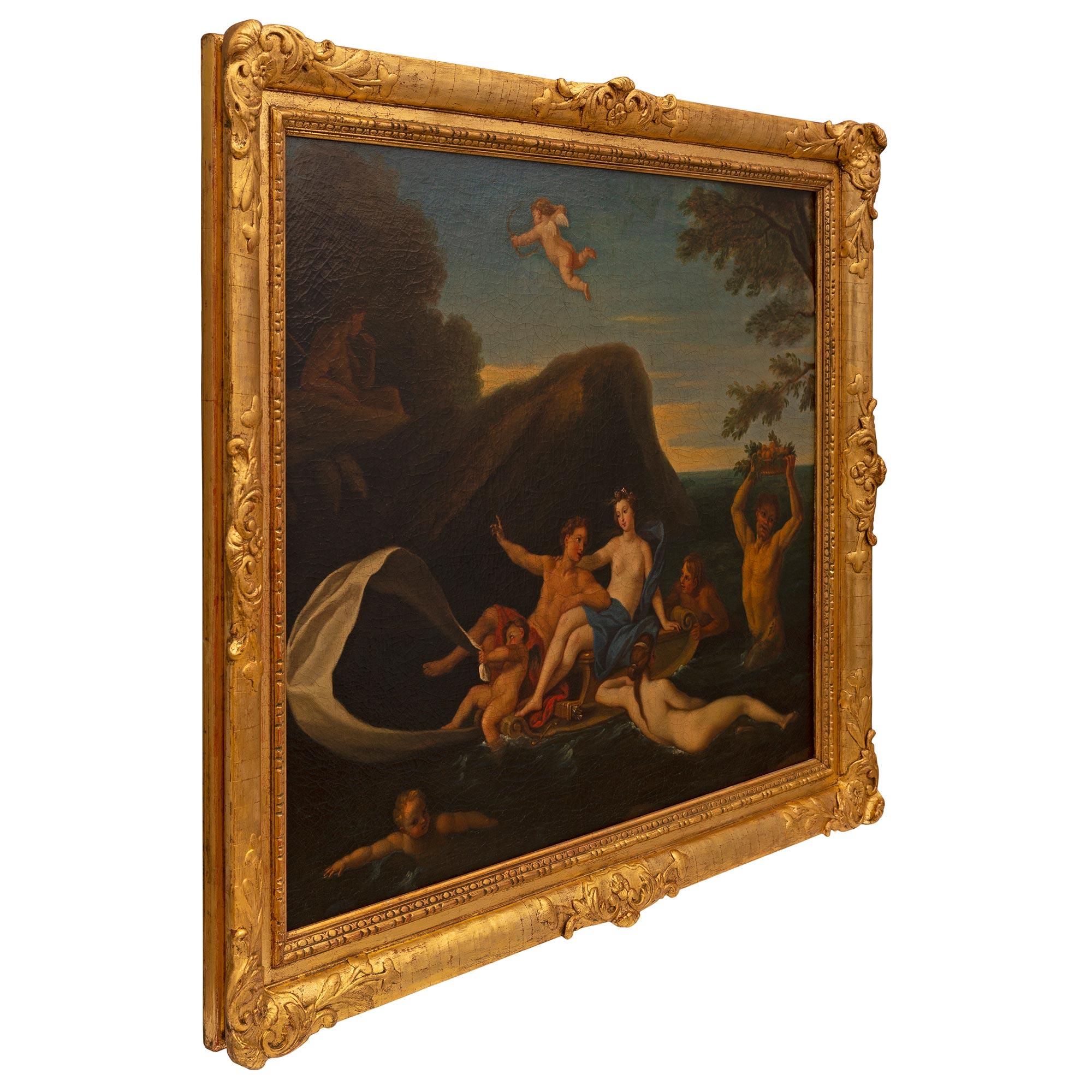 An outstanding Continental 19th century oil on canvas painting in its original giltwood frame. The beautiful painting depicts Venus at the center laying on a boat with a young man at her side and a charming cherub at the front holding a sail. An