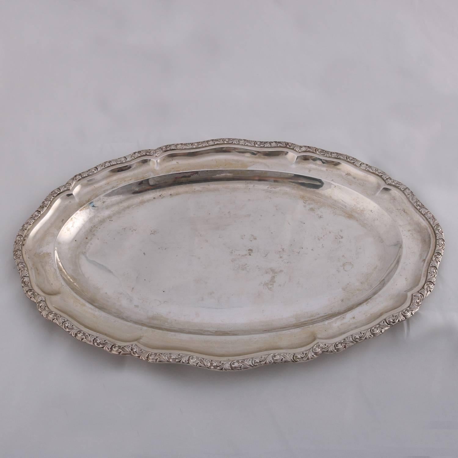 Continental .800 silver tray possibly Bohemia and Moravia features scalloped oval form with a flat-bottomed oval well and foliate rim, rim touch marks include .800 and triangle reminiscent of number 5 in triangle (silver fineness .800)