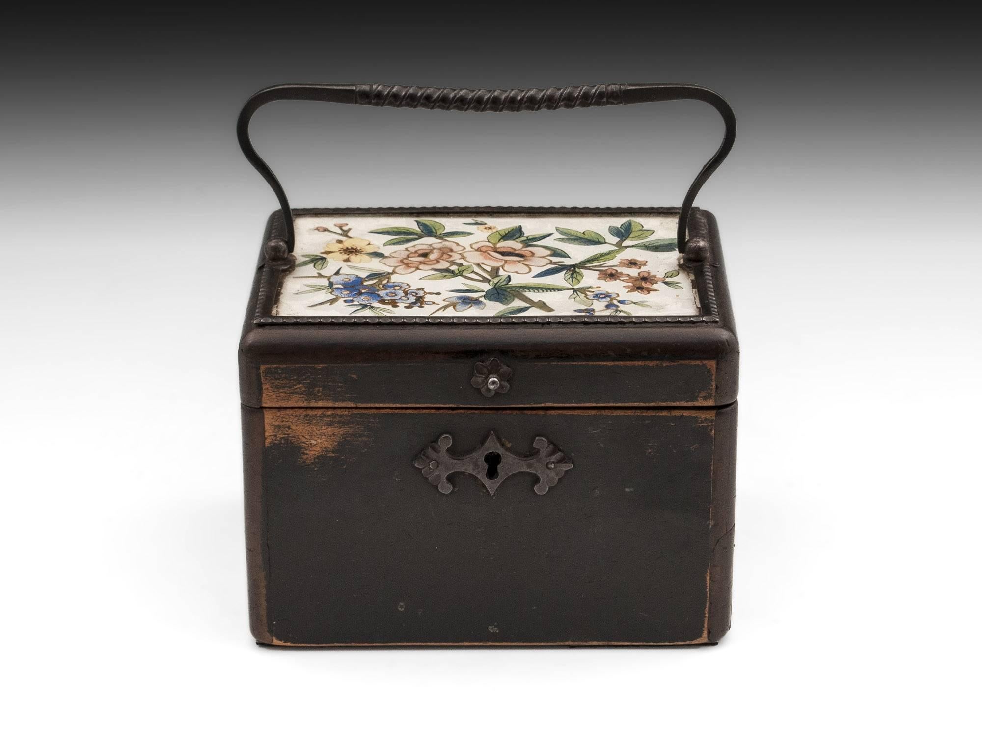 Sycamore tea caddy, floral painted with gold highlights under a glass top. With a cut steel handle, surround, escutcheon and finger pull. 

This wonderful eye-catching sycamore tea caddy is from Hungary and comes complete with fully working lock,