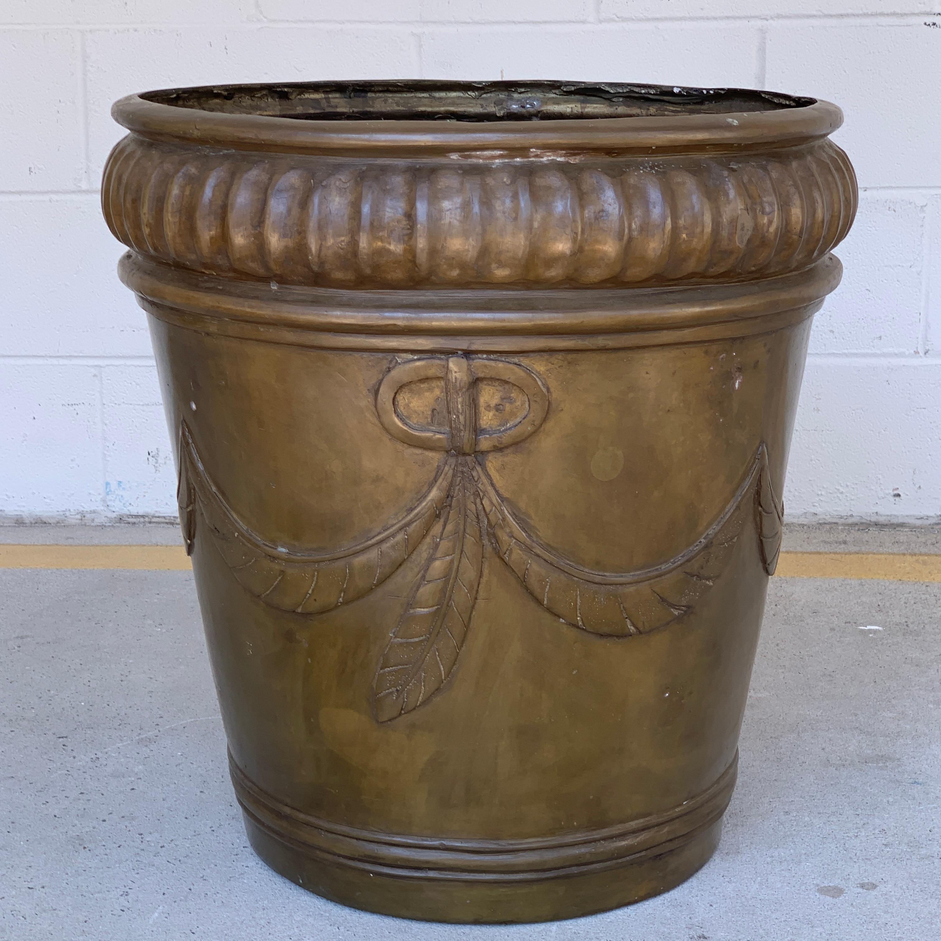 Continental bronze Palmette neoclassical planter, with ribbed top, and continuous Palmette decoration. 22 inches high x 24 inch diameter, tapering to a 14.5 inch diameter base. Can be used indoors or outdoors.

 