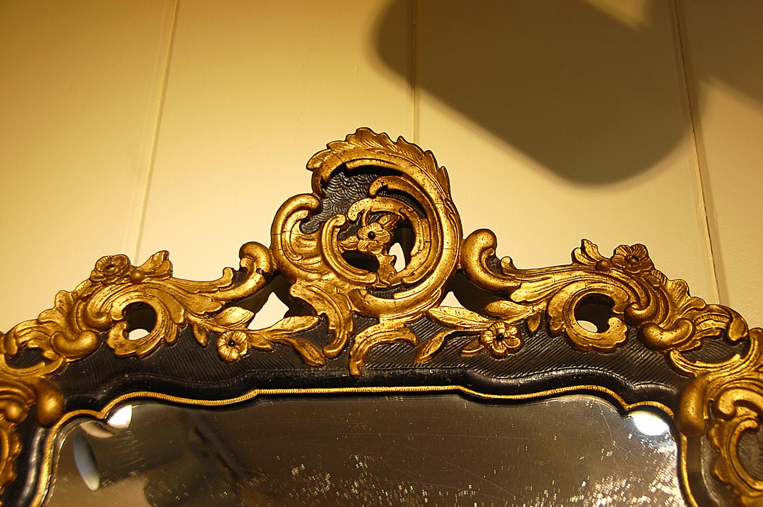 Rococo Continental Carved Early 19th Century Parcel-Gilt Mirror Leaf and Shell on Black