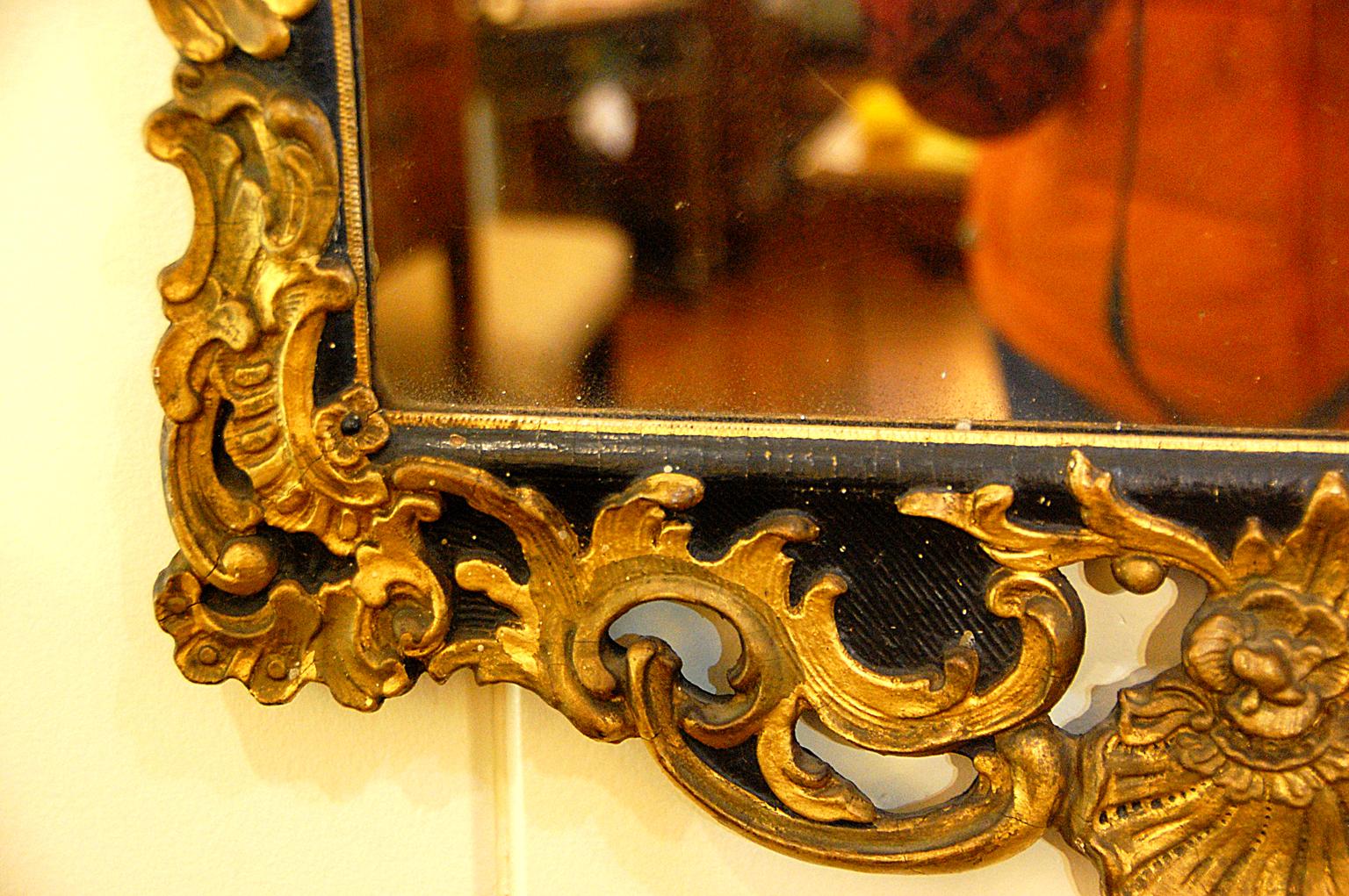 18th Century Continental Carved Early 19th Century Parcel-Gilt Mirror Leaf and Shell on Black