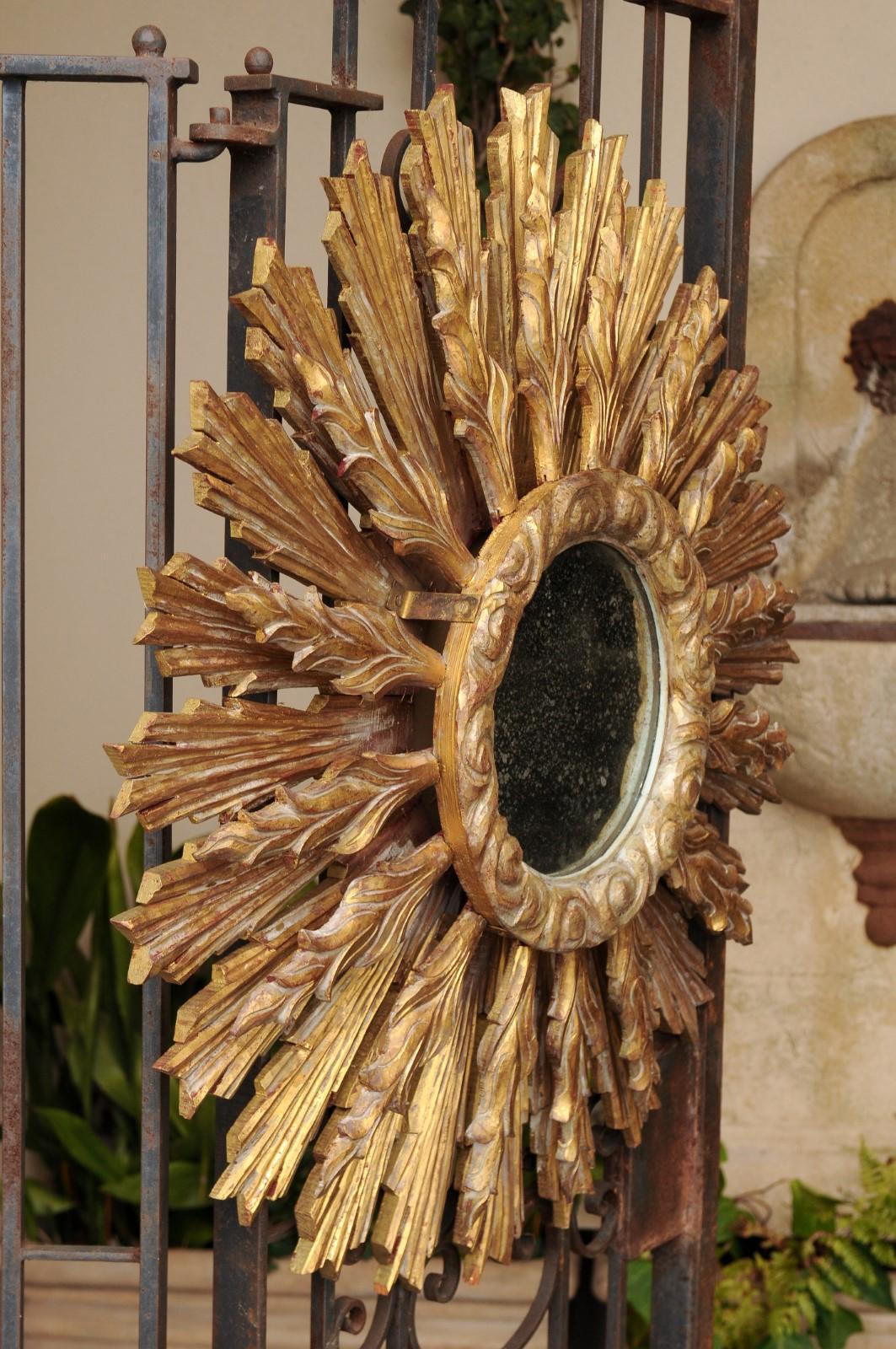 Continental Carved Giltwood Sunburst Mirror with Layered Rays and Cloudy Motifs 2