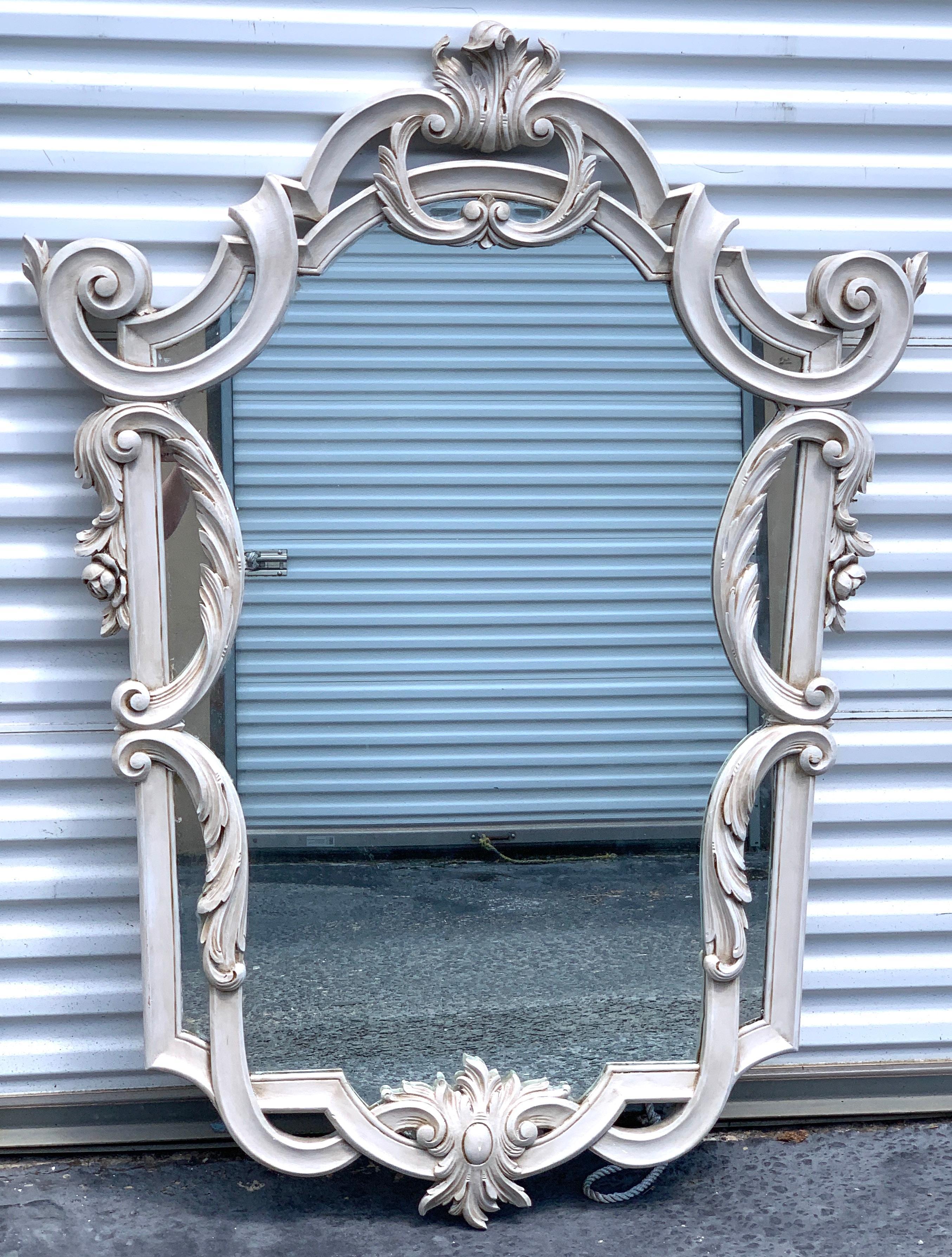 Continental carved neoclassical grey painted shield mirror, with inset 28