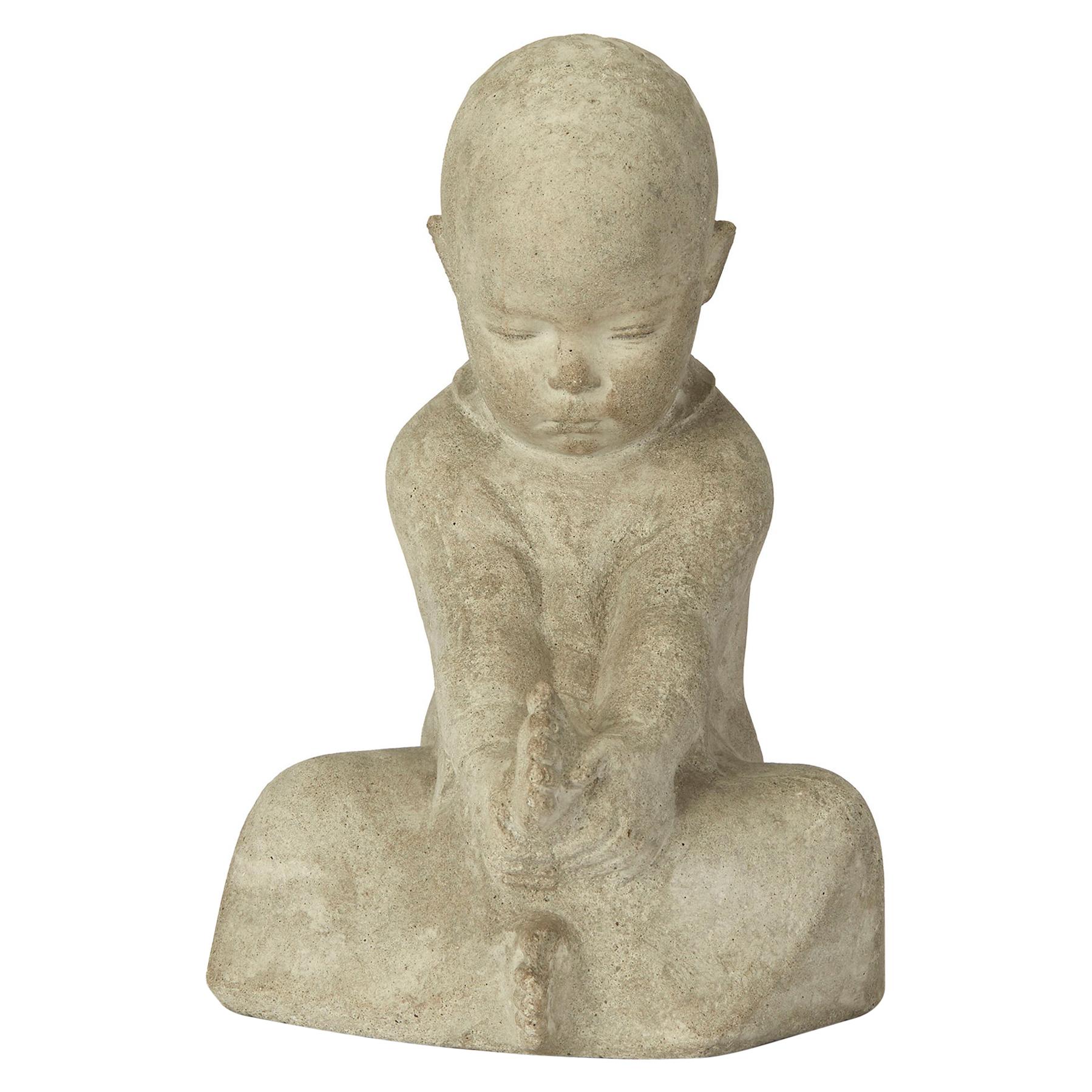 Continental Carved Stone Figure of a Seated Infant, 20th Century