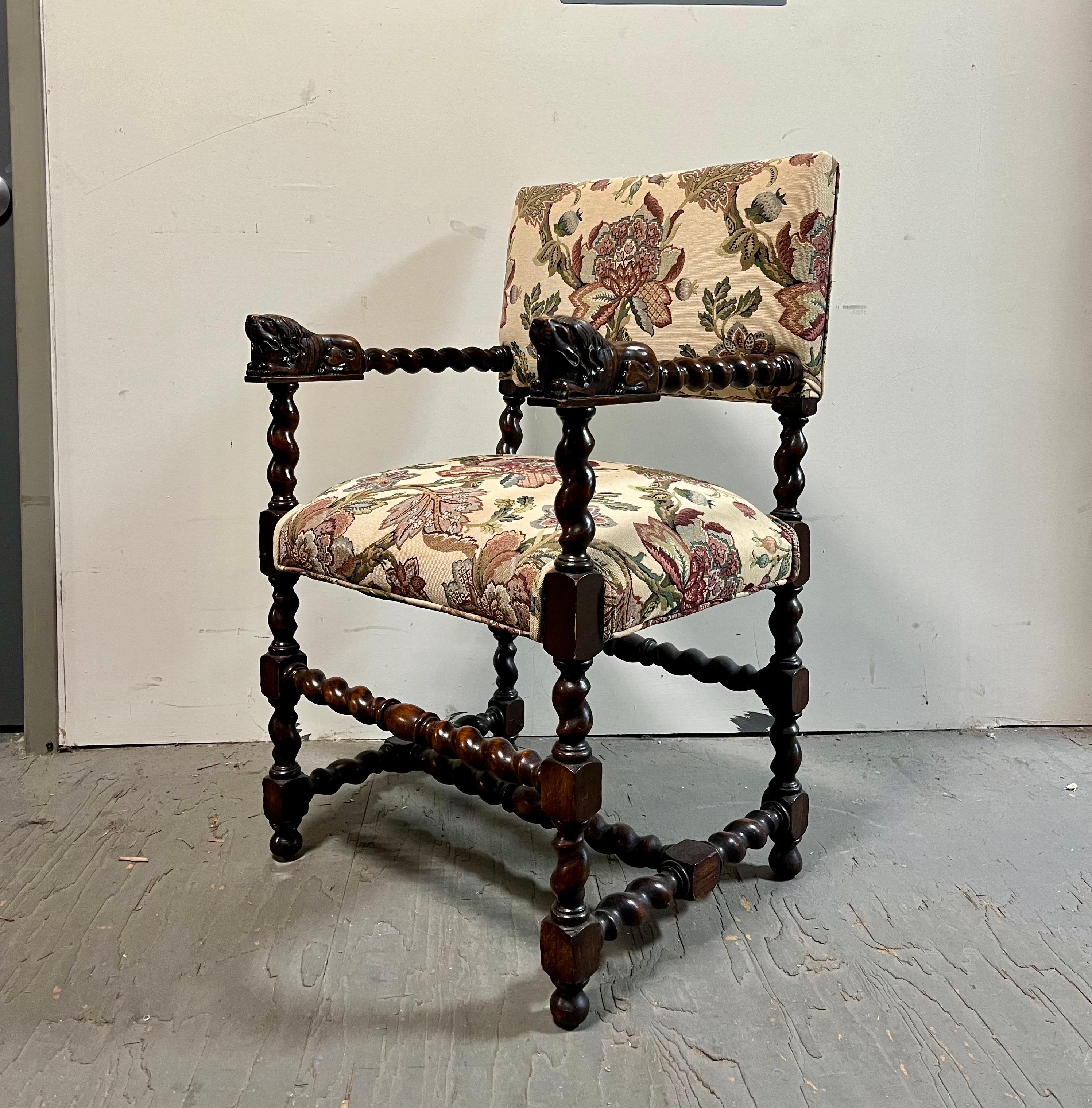 Beautiful country chair. The chair's barley twist arms are topped by two recumbent lions, and the legs of the chair are also in a barley twist motif.