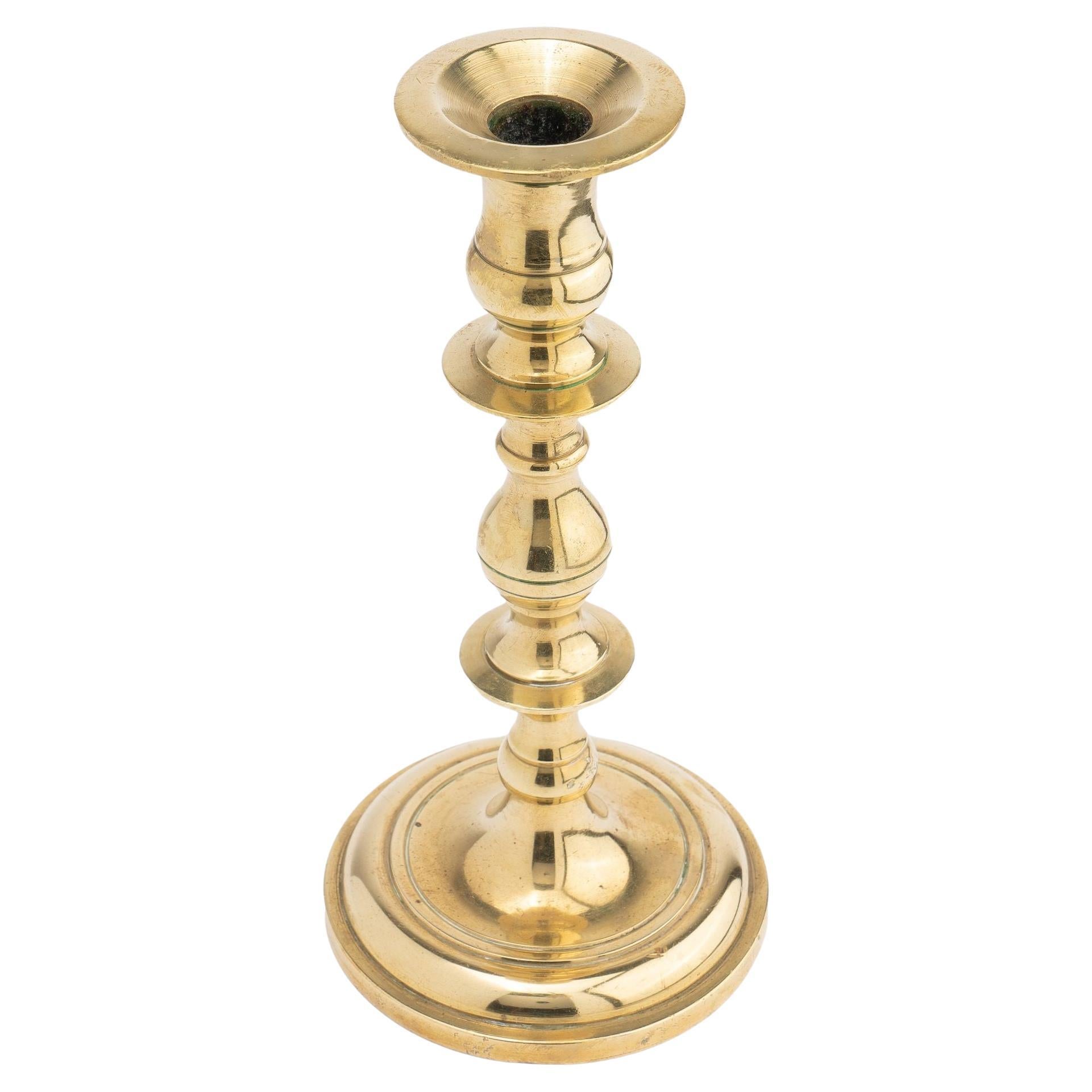 Continental core cast brass candlestick, 1700's For Sale