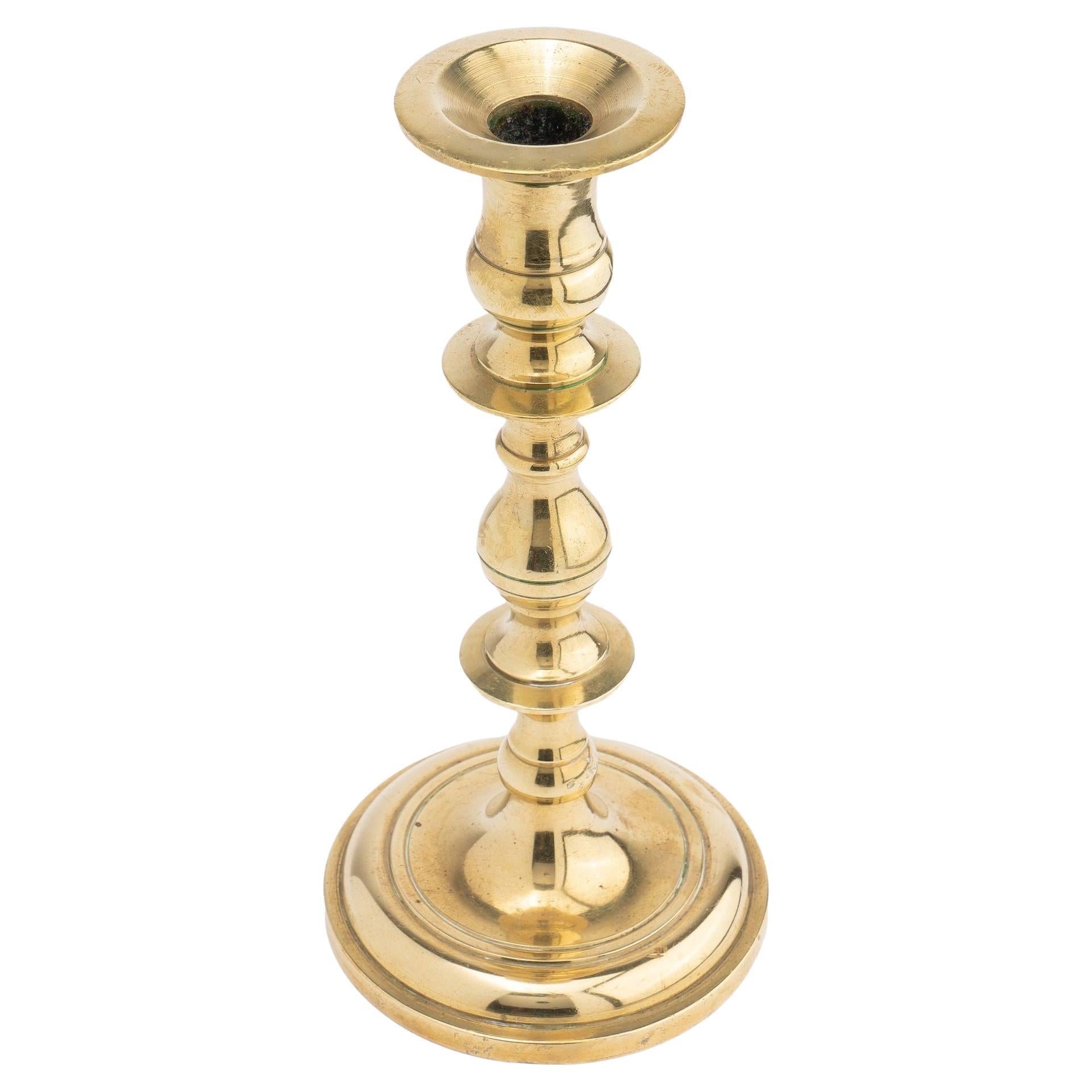 Continental core cast brass candlestick, 1700's