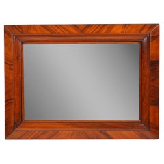 Continental cross banded walnut mirror, c. 1825