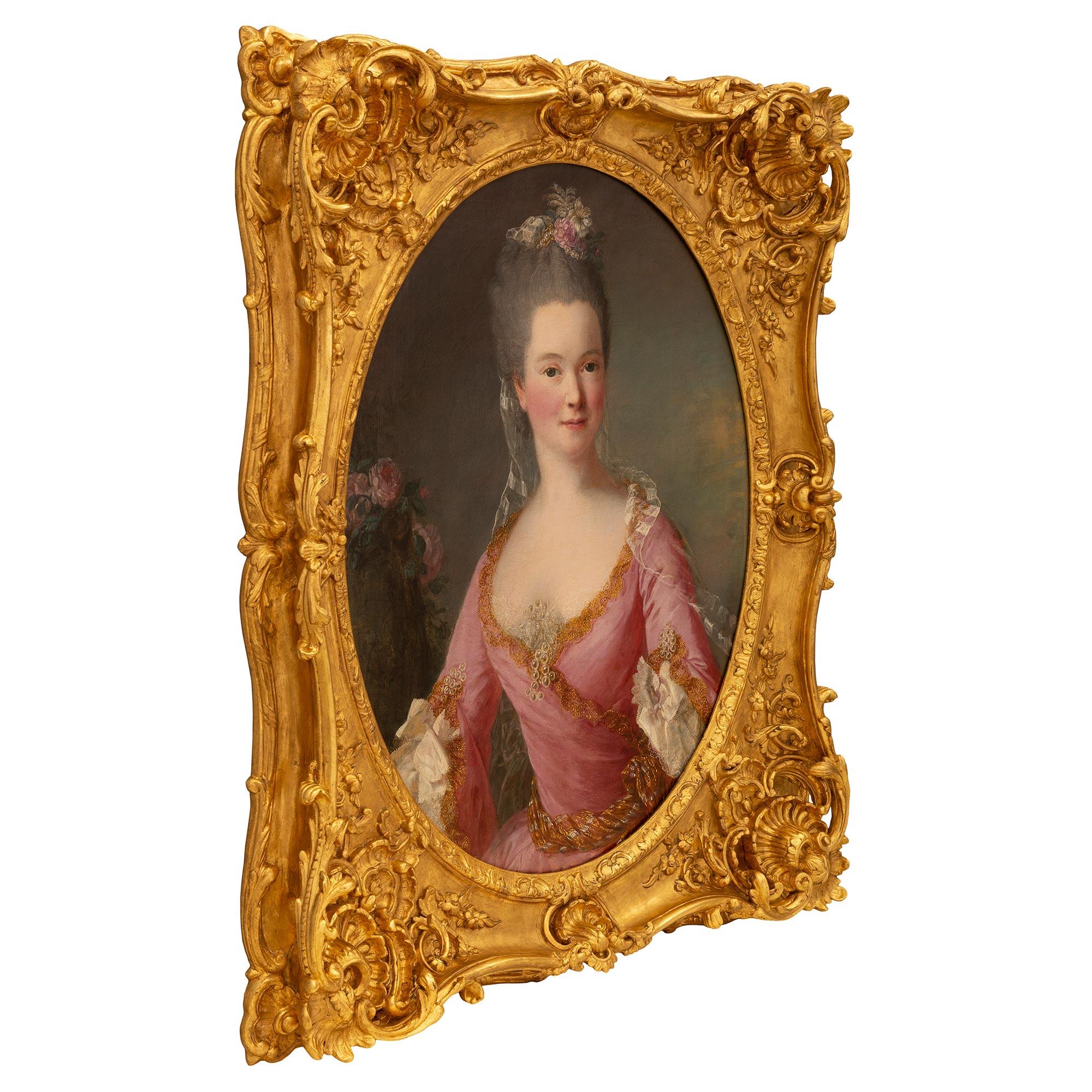 A stunning and extremely high quality Continental early 19th century Louis XV st. oil on canvas portrait. The painting depicts a beautiful young maiden dressed in a most elegant pink garment adorned with pearls. She wears her hair in an updo with