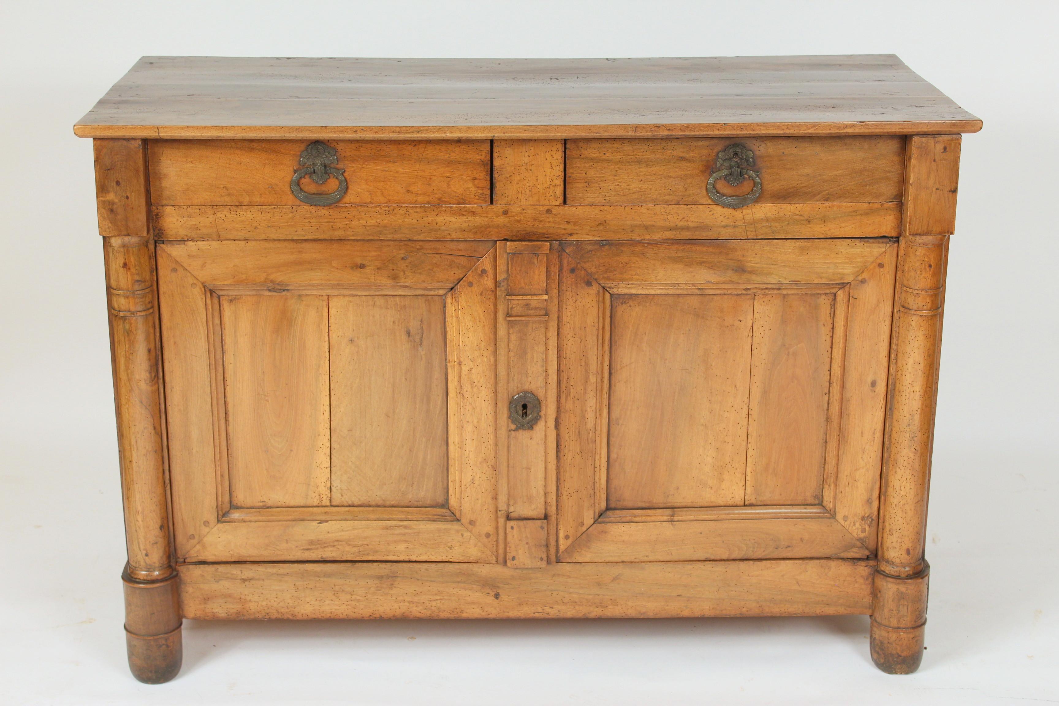 Continental Empire walnut and fruitwood buffet, circa 1820. This buffet has excellent old color, mortise and Tenon case construction and dove tailed drawers.