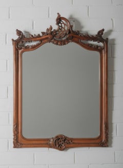 Continental European Hand-Carved Wood Mirror with Rococo-Inspired Crest