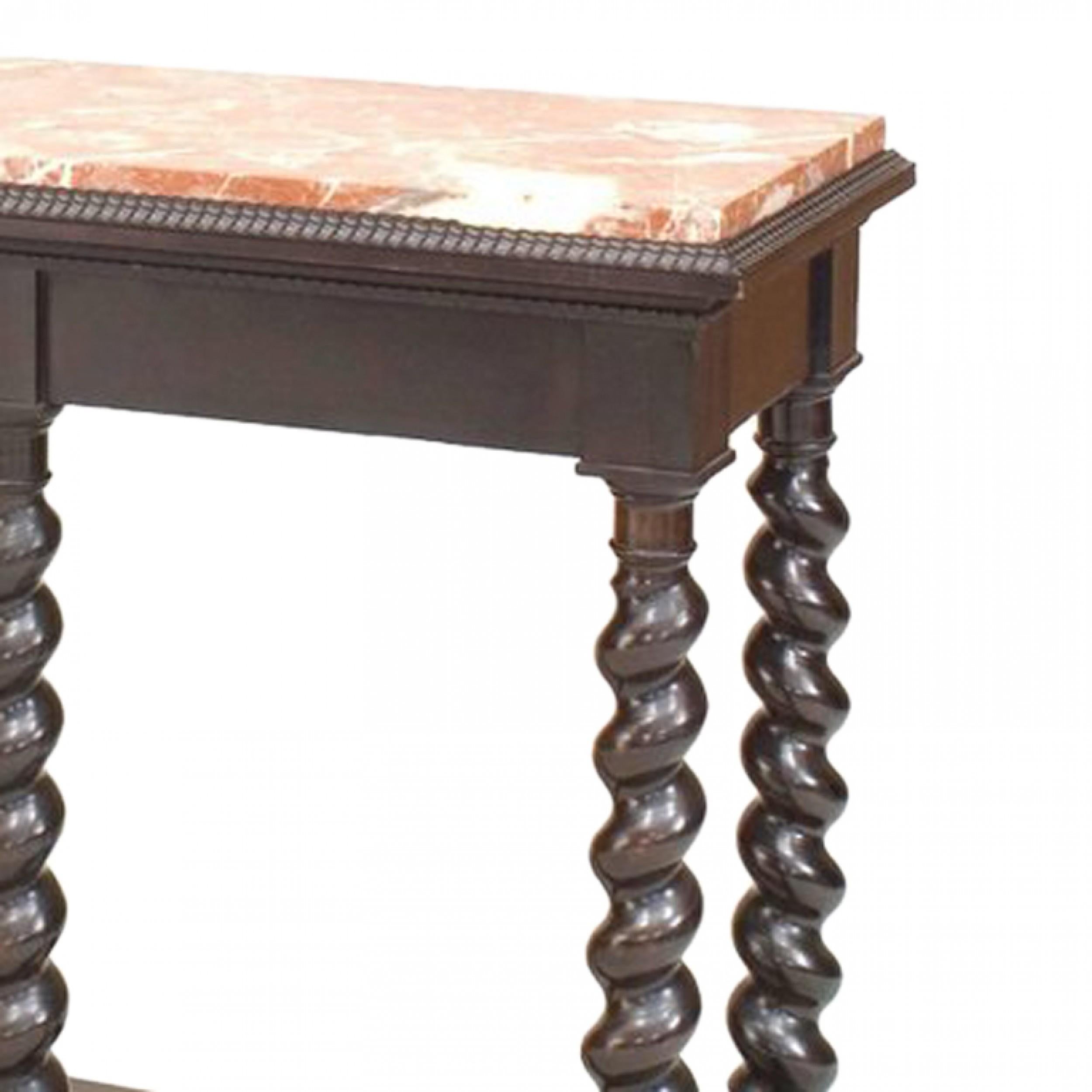 Continental (Possibly Flemish 19/20th Century) ebonized console table with 6 spool legs and brown marble top with stretcher base. (Related item: PPF077)

Chip on one corner of marble. Antique condition.